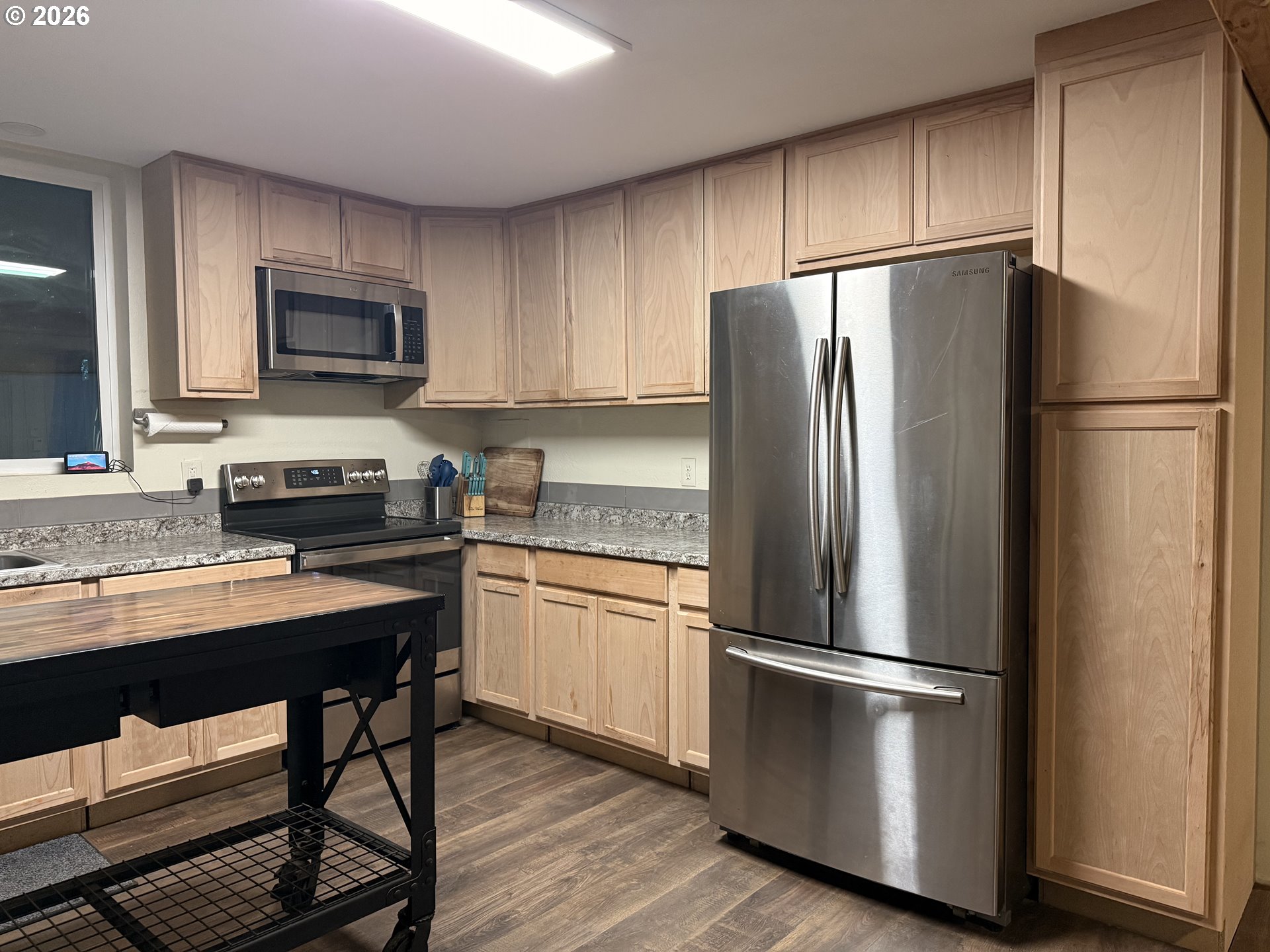 75840 Leezer Avenue Echo, OR 97826 - Photo 8 of 21 a kitchen with stainless steel appliances a refrigerator a stove a sink and a refrigerator