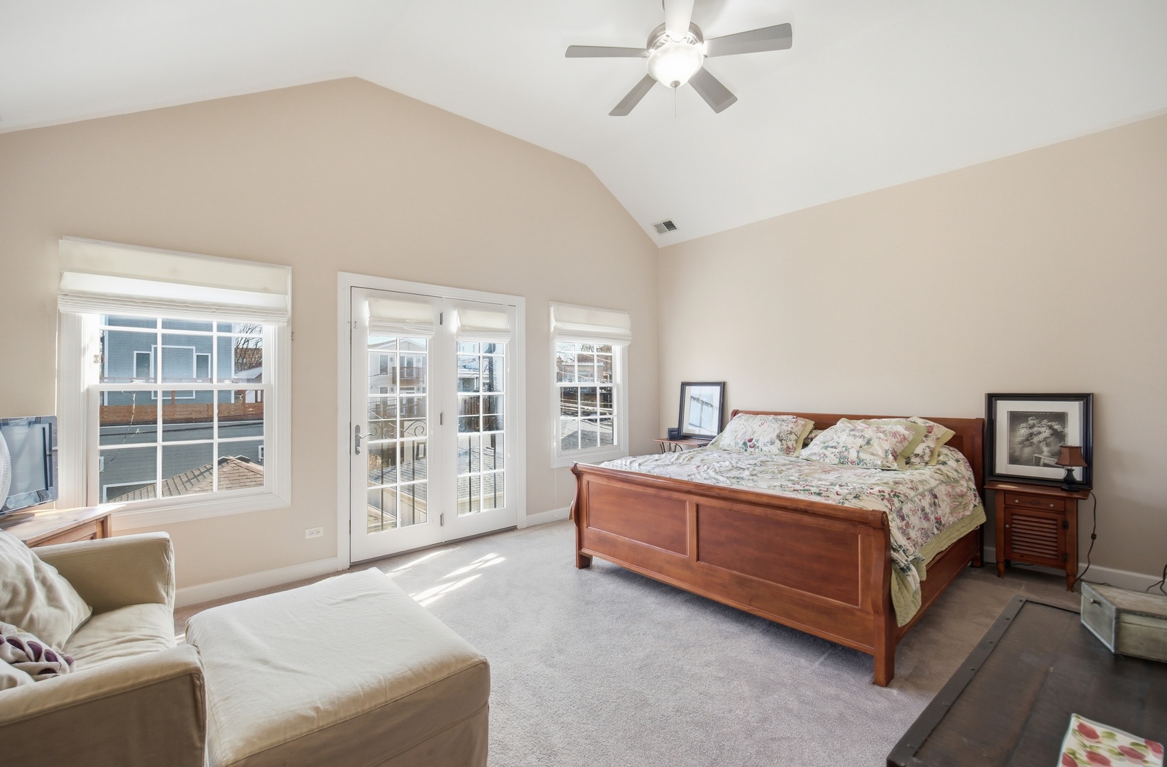 2229 West School Street Chicago, IL 60618 - Photo 13 of 29 a bedroom with a large bed couch and a window