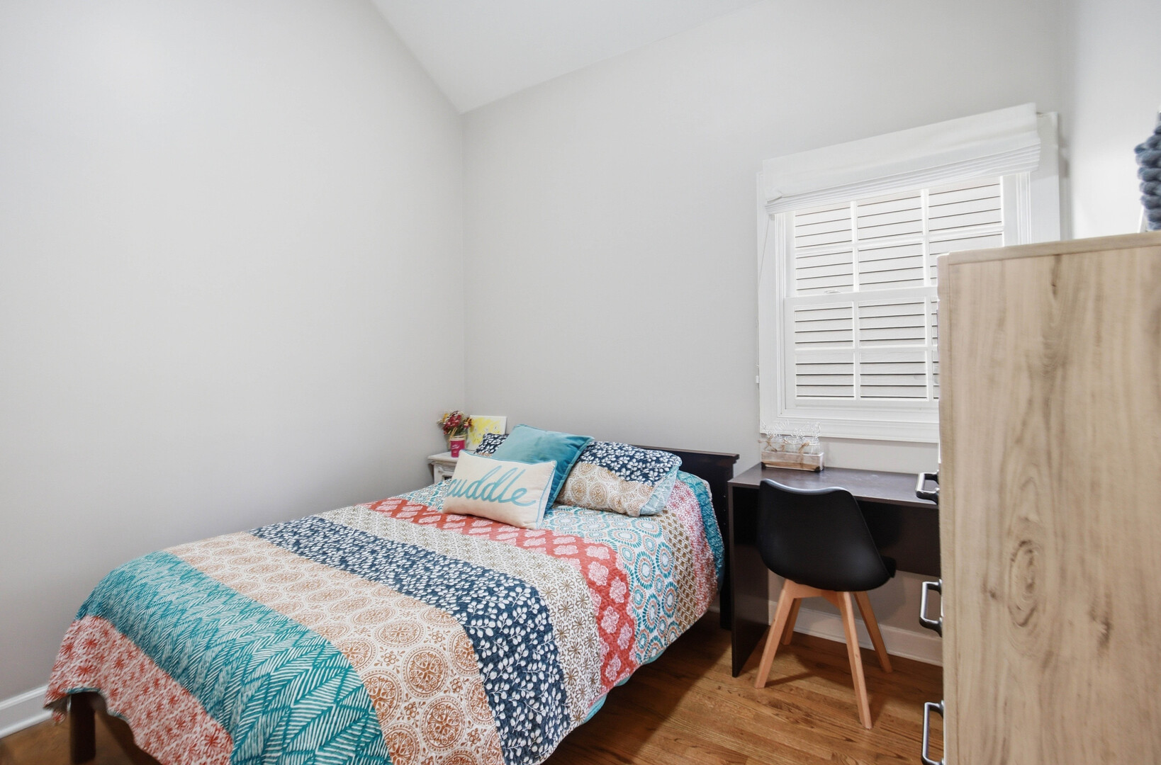 2229 West School Street Chicago, IL 60618 - Photo 15 of 29 a bedroom with a bed and a chair