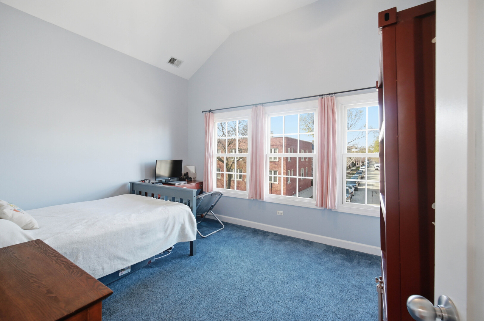 2229 West School Street Chicago, IL 60618 - Photo 16 of 29 a bedroom with a bed and a large window