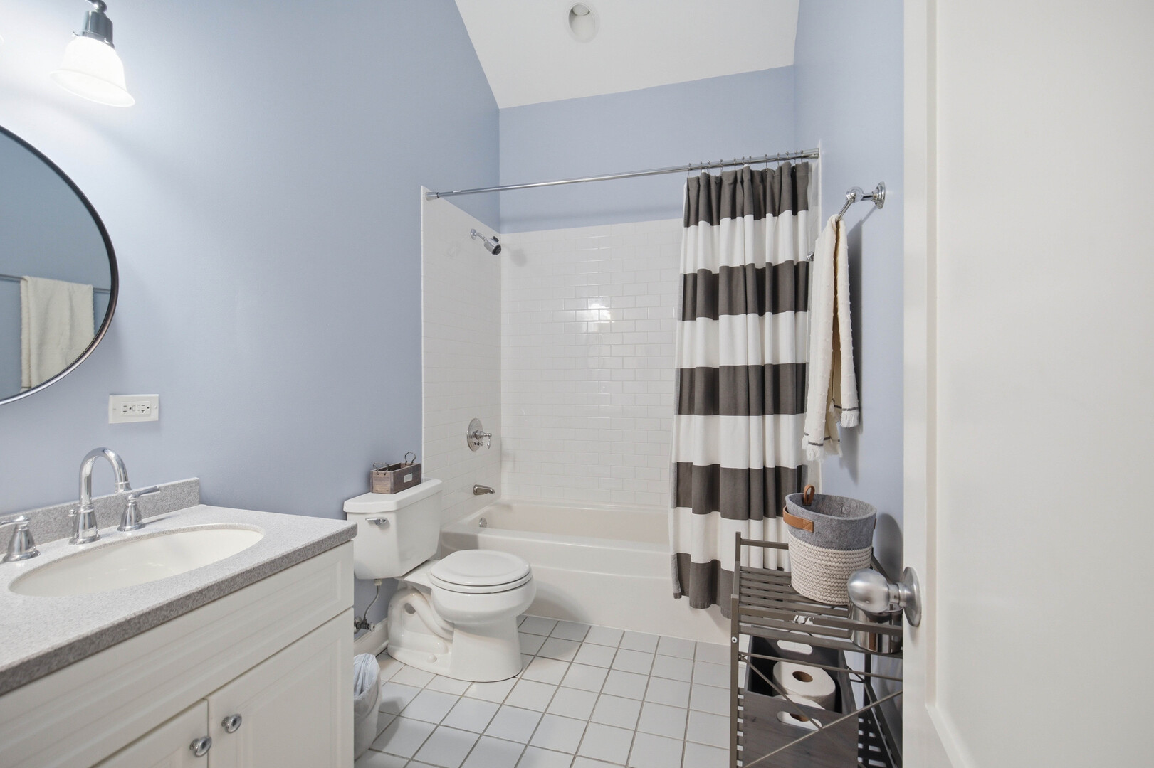 2229 West School Street Chicago, IL 60618 - Photo 17 of 29 a bathroom with a sink a toilet and shower