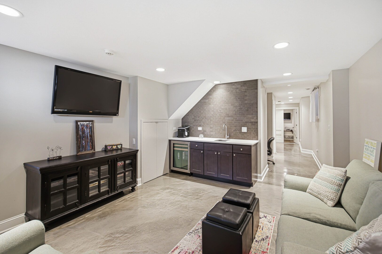 2229 West School Street Chicago, IL 60618 - Photo 18 of 29 a living room with furniture and a flat screen tv