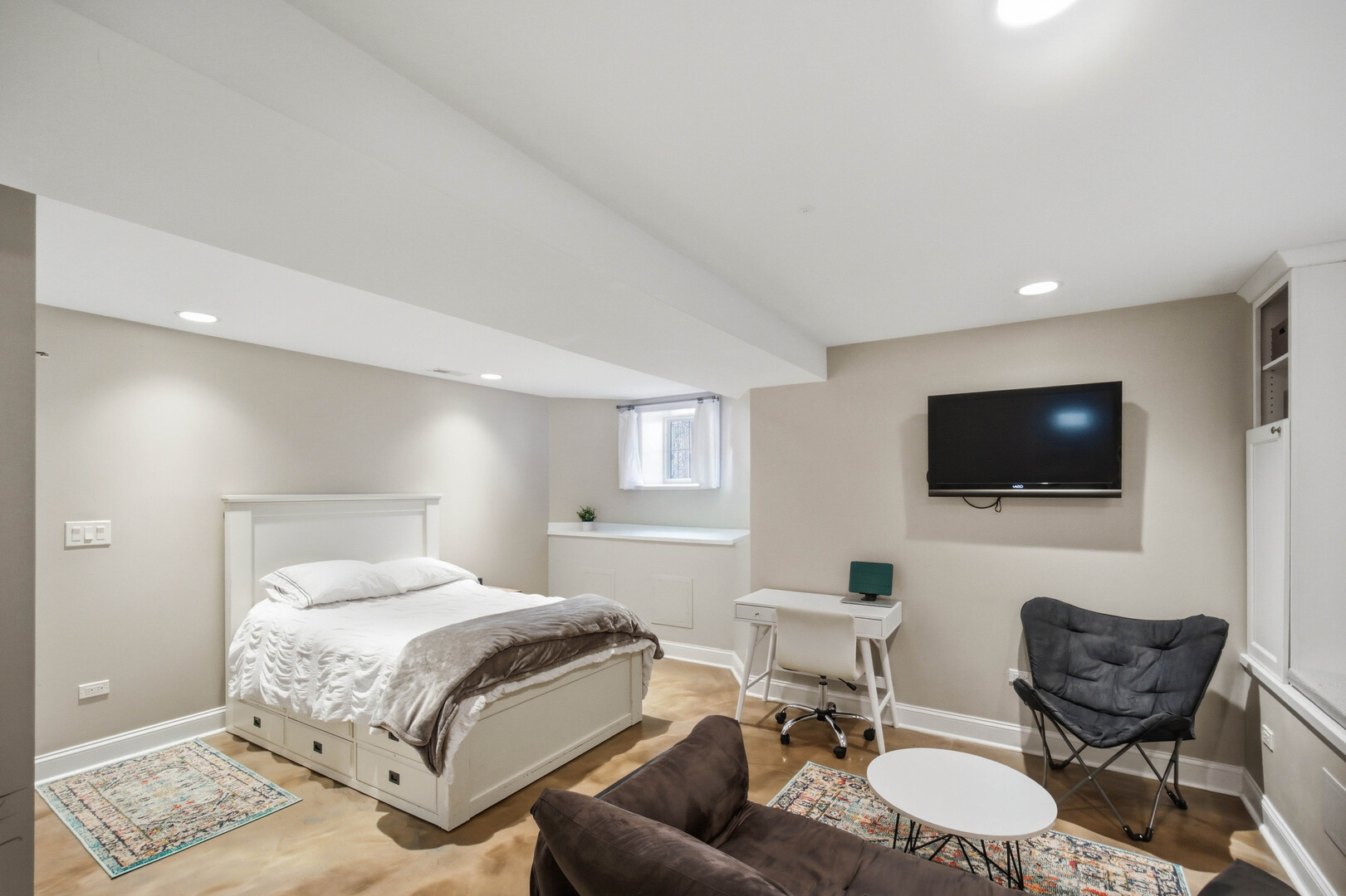 2229 West School Street Chicago, IL 60618 - Photo 19 of 29 a bedroom with a bed and a flat screen tv