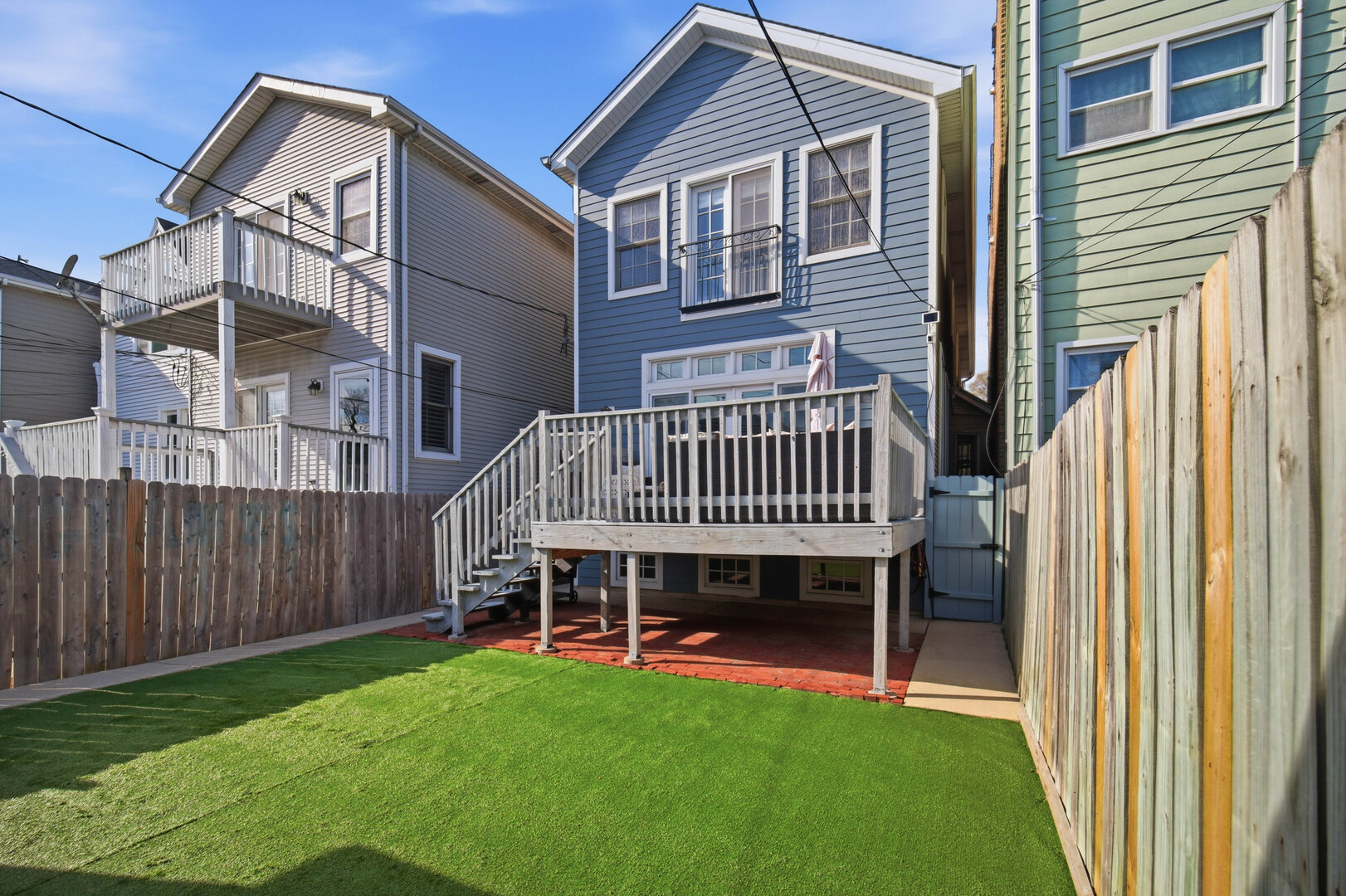 2229 West School Street Chicago, IL 60618 - Photo 2 of 29 a view of a house with a yard and deck