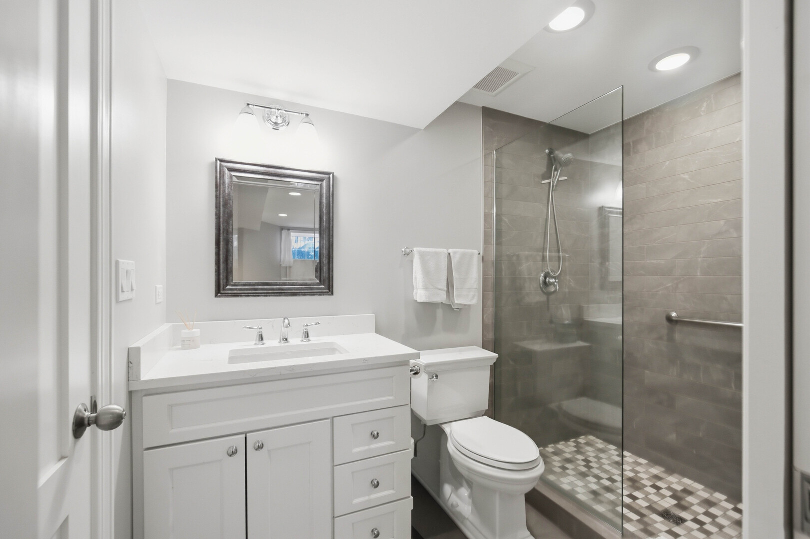 2229 West School Street Chicago, IL 60618 - Photo 21 of 29 a bathroom with a sink toilet and shower