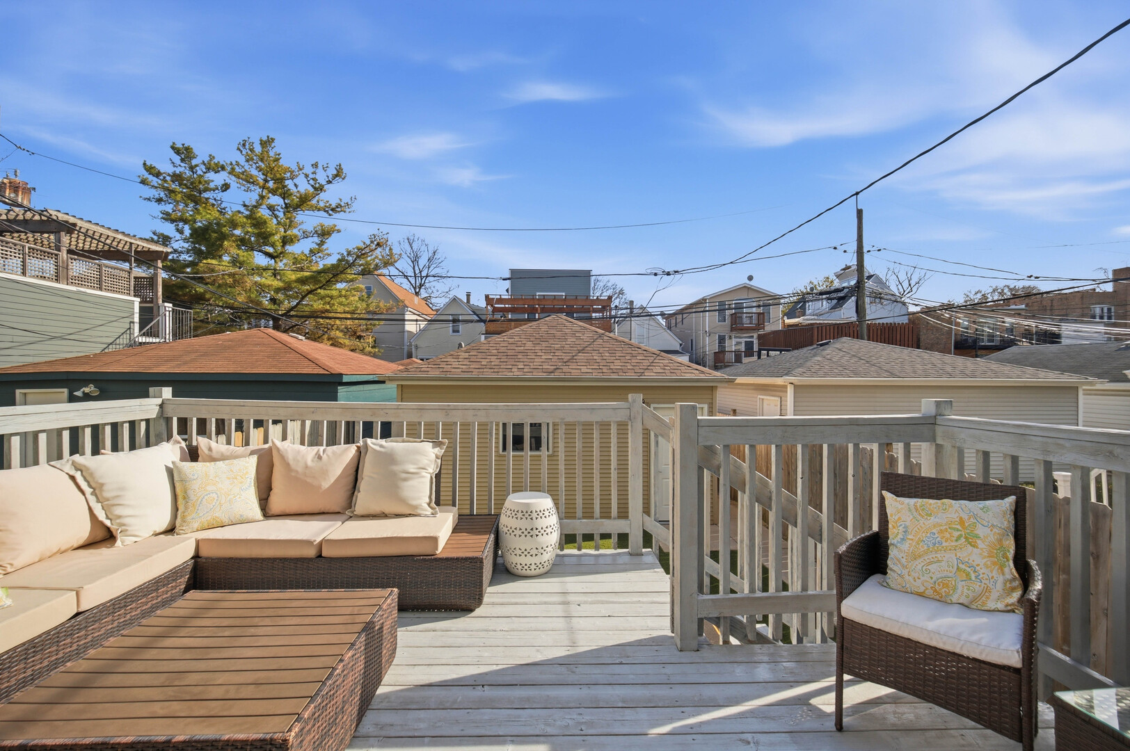 2229 West School Street Chicago, IL 60618 - Photo 3 of 29 a roof deck with couches and wooden floor