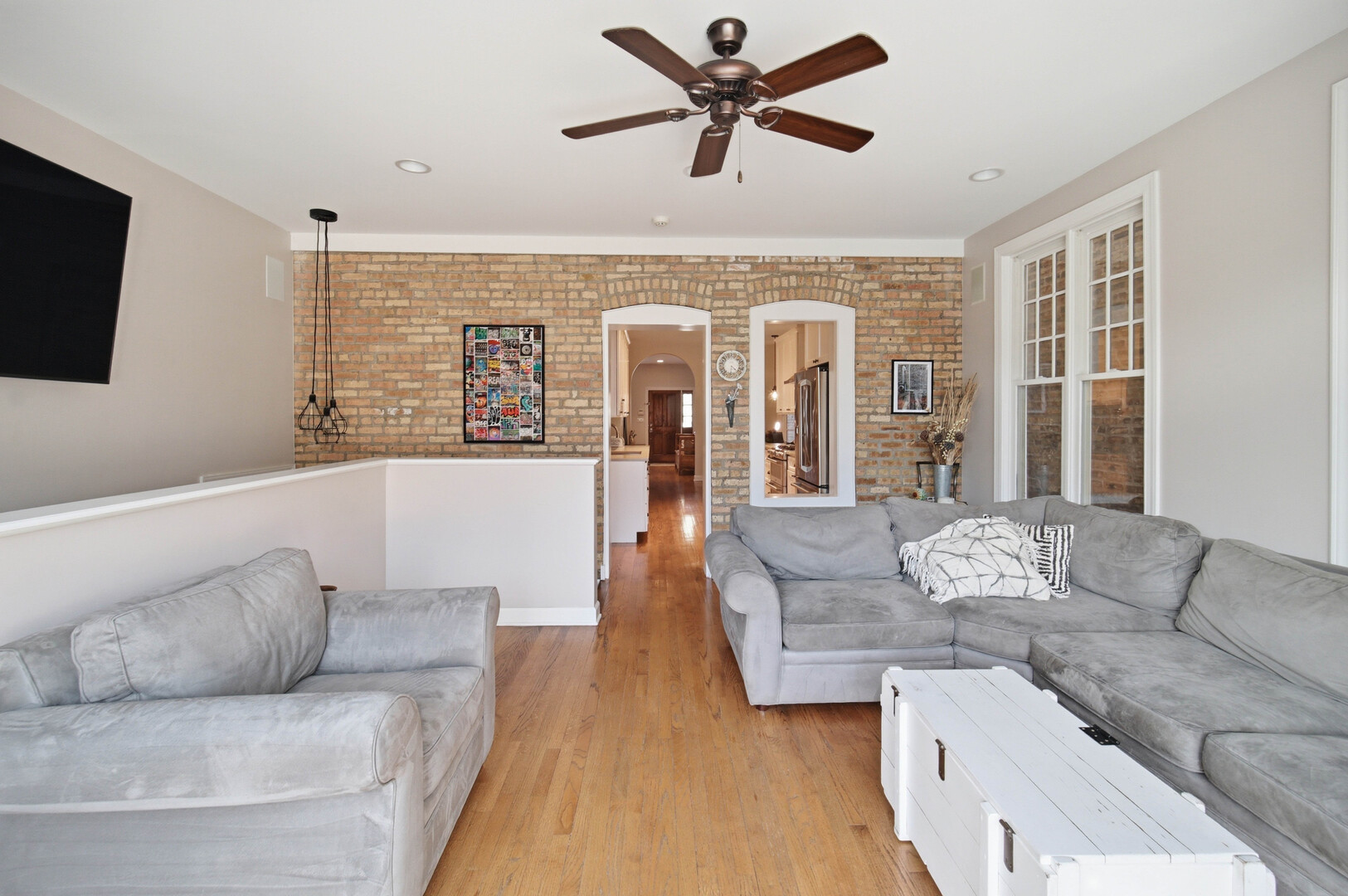 2229 West School Street Chicago, IL 60618 - Photo 4 of 29 a living room with furniture and a flat screen tv