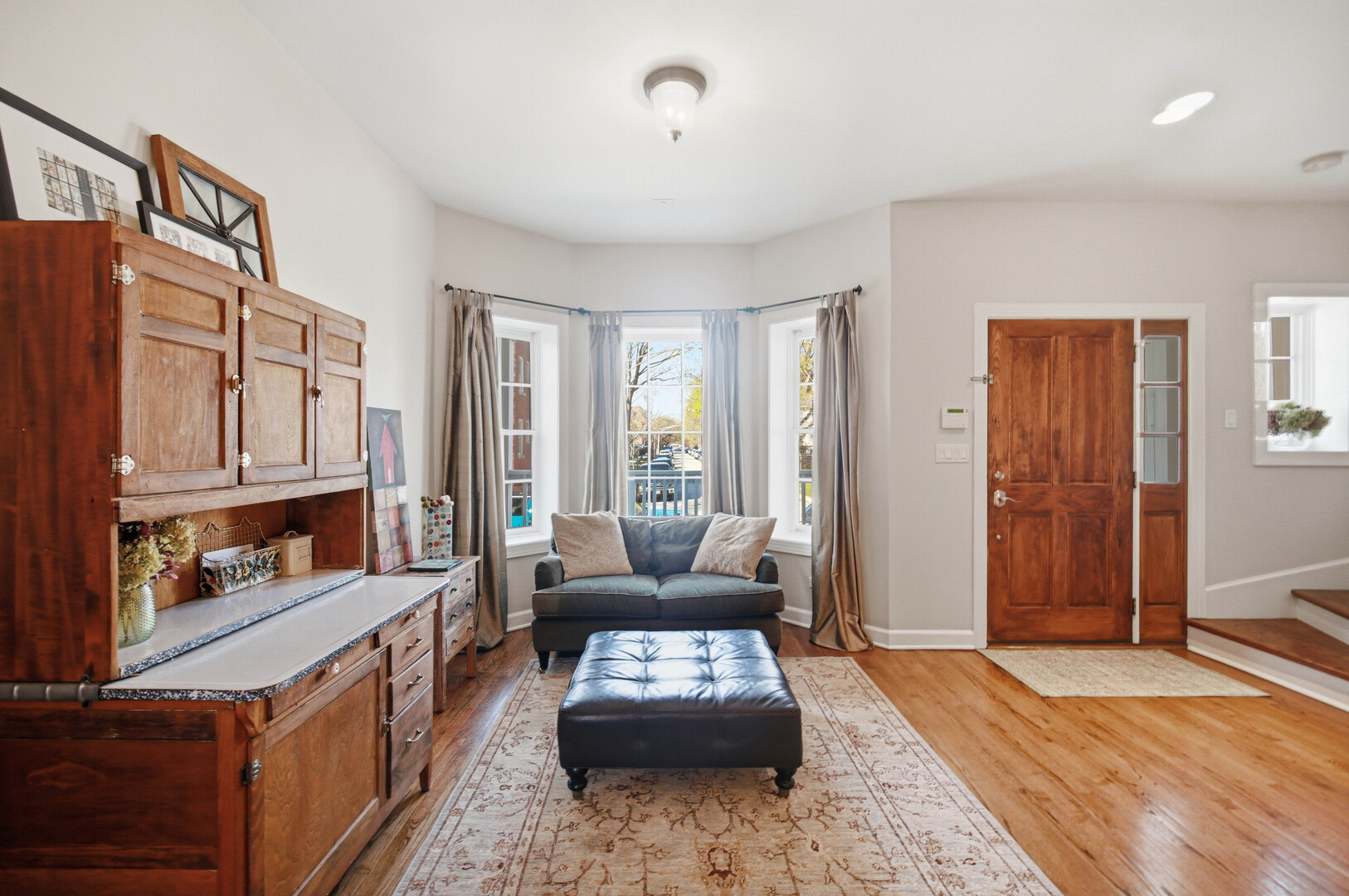 2229 West School Street Chicago, IL 60618 - Photo 8 of 29 a living room with furniture and a wooden floor