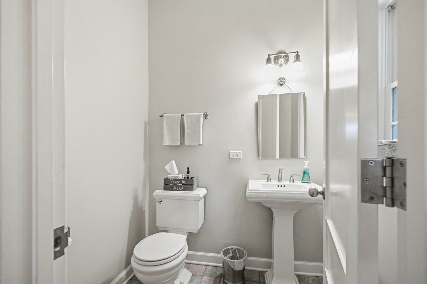 2229 West School Street Chicago, IL 60618 - Photo 10 of 29 a bathroom with a sink toilet and mirror