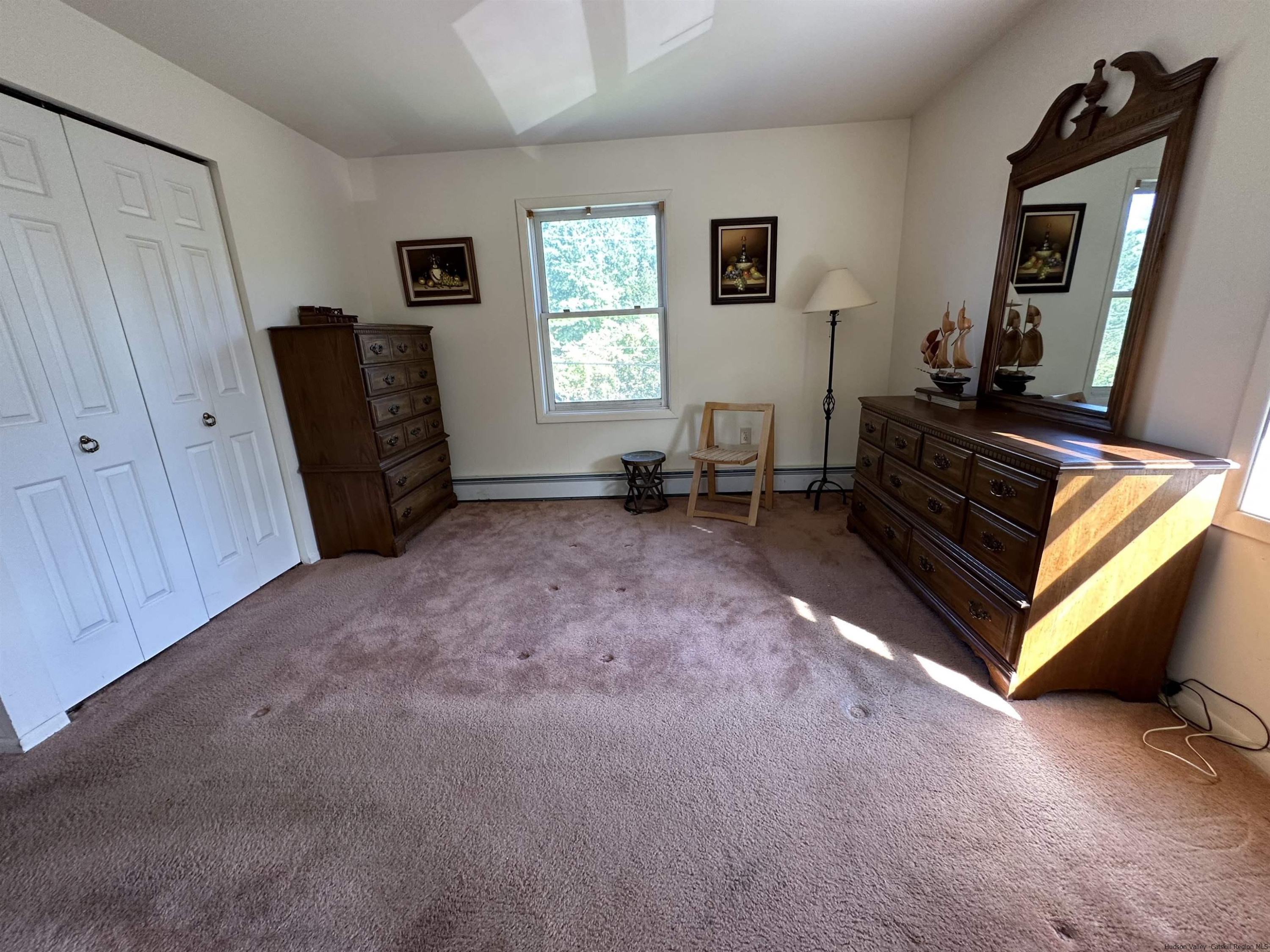 343 Cascade Drive Kingston, NY 12401 - Photo 15 of 33 a living room with furniture and a window