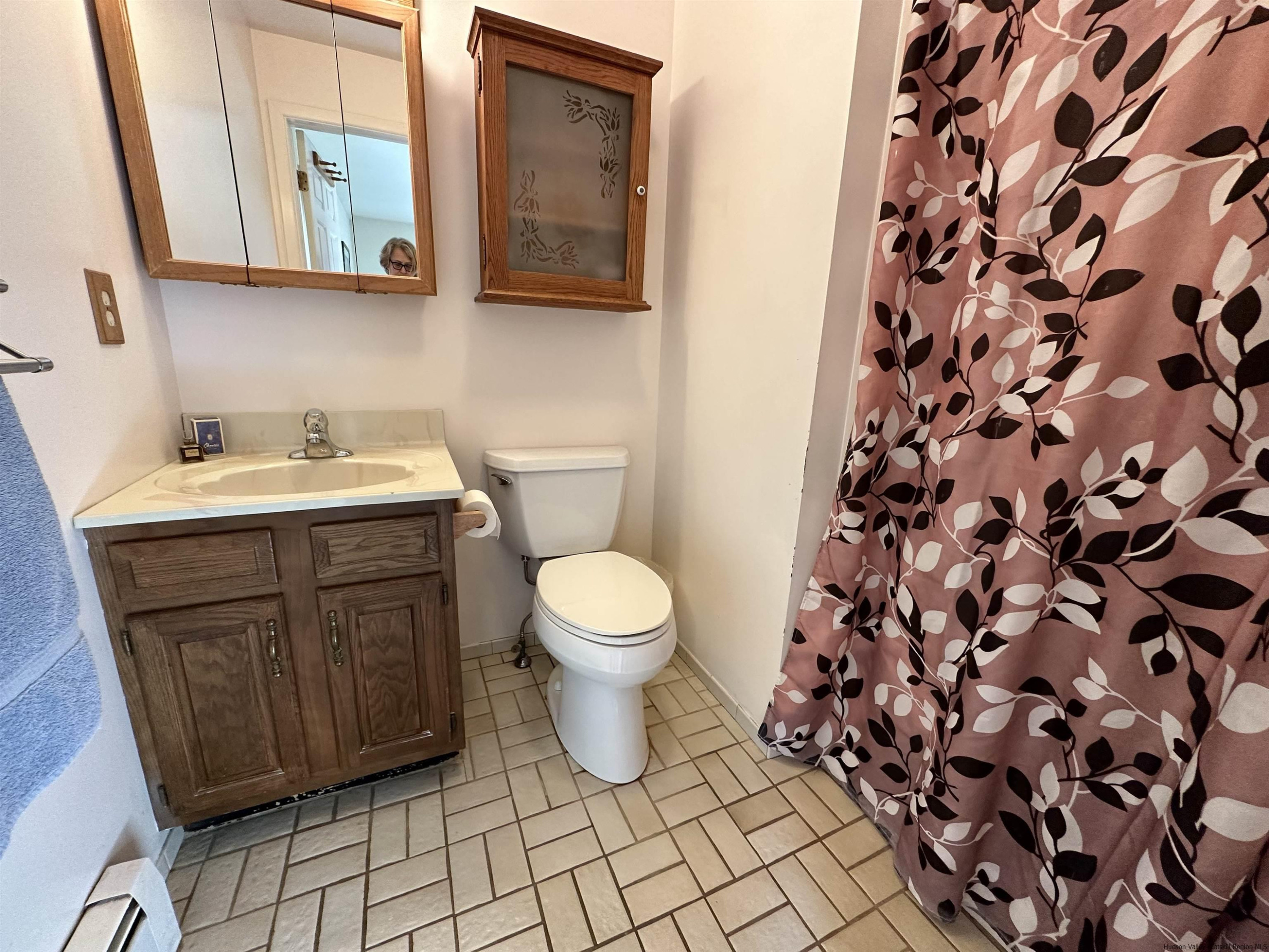 343 Cascade Drive Kingston, NY 12401 - Photo 18 of 33 a bathroom with a toilet sink and mirror