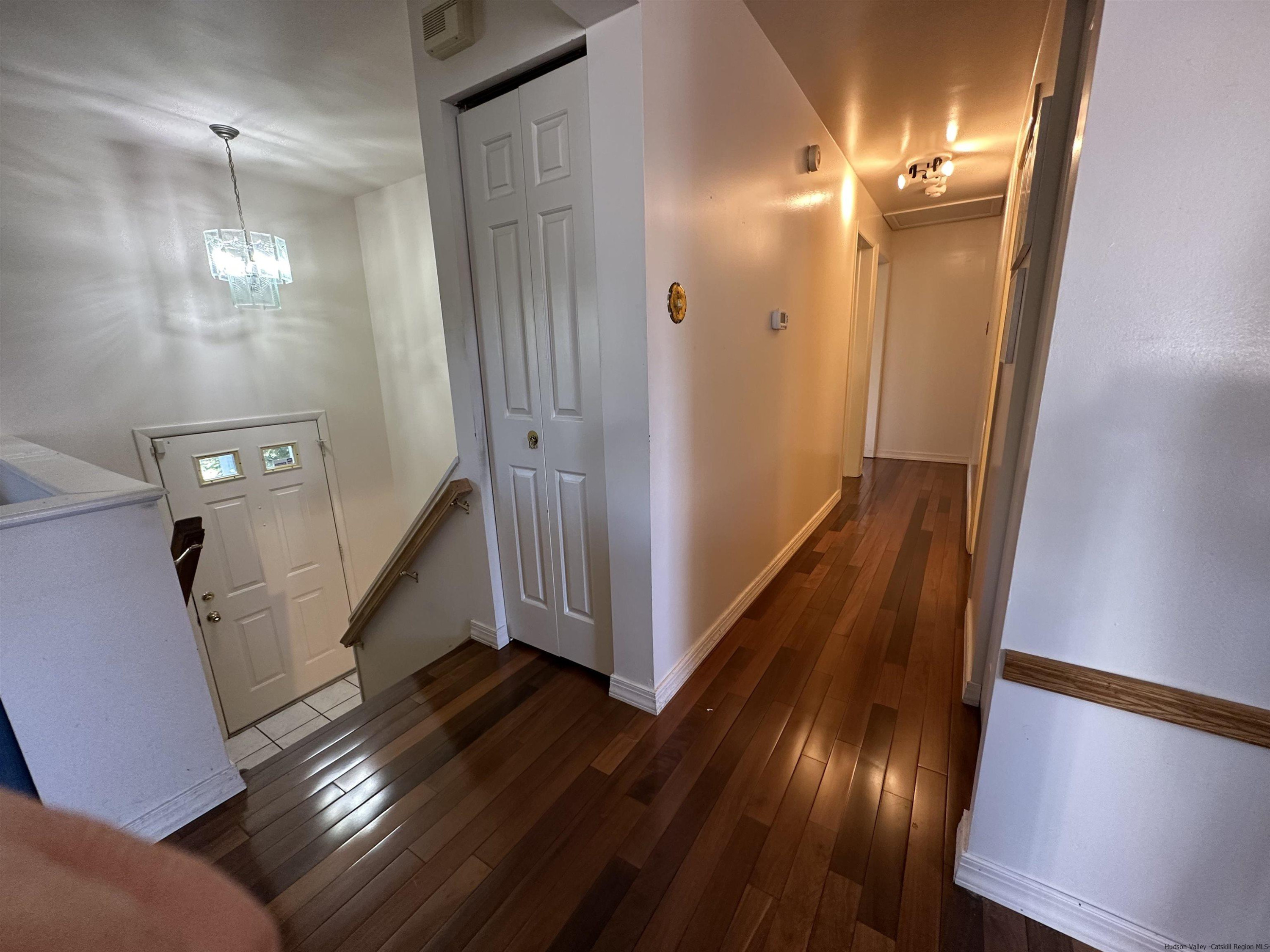 343 Cascade Drive Kingston, NY 12401 - Photo 19 of 33 a view of a livingroom with wooden floor and staircase