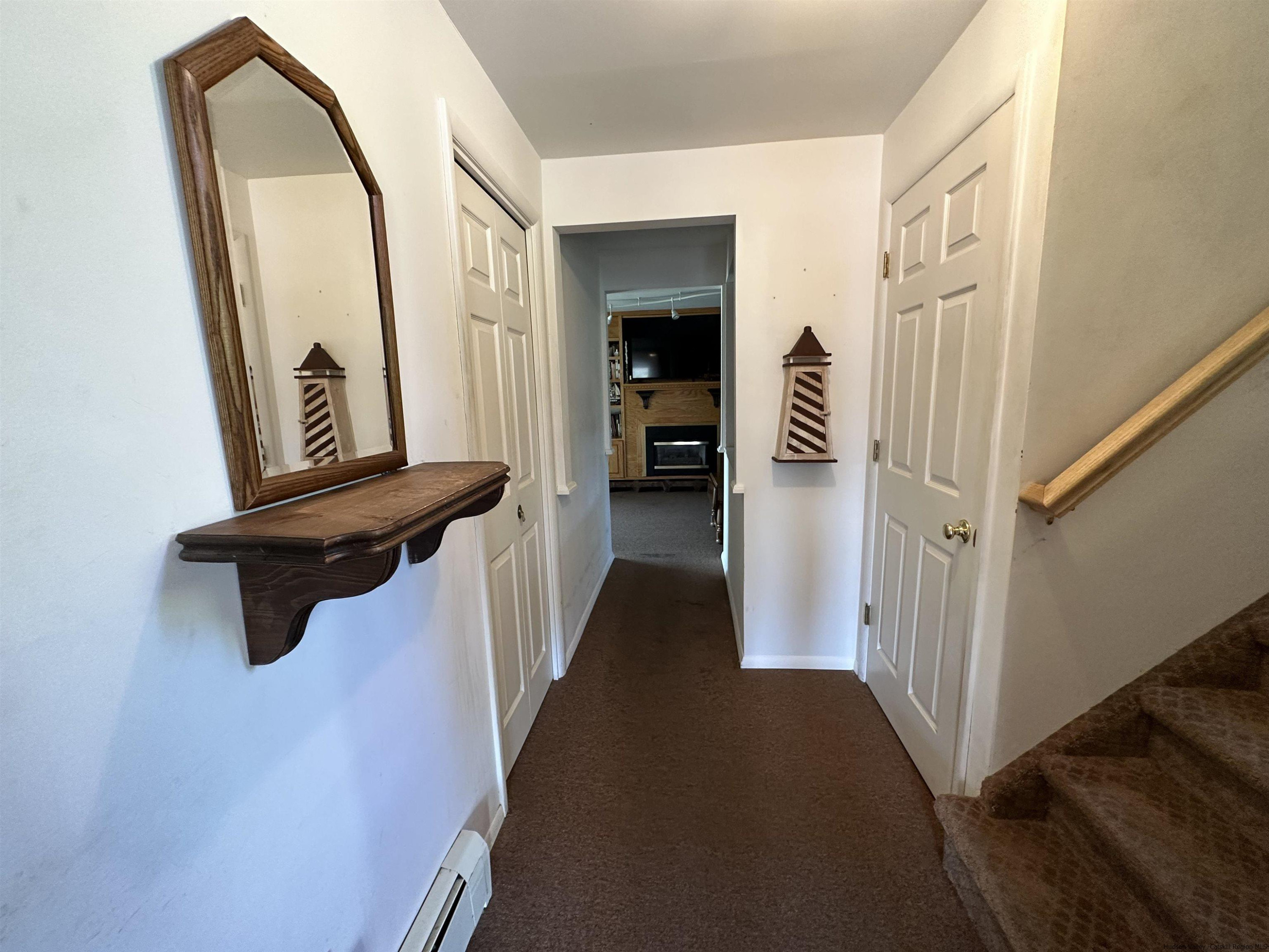 343 Cascade Drive Kingston, NY 12401 - Photo 20 of 33 a view of a hallway with wooden floor and staircase