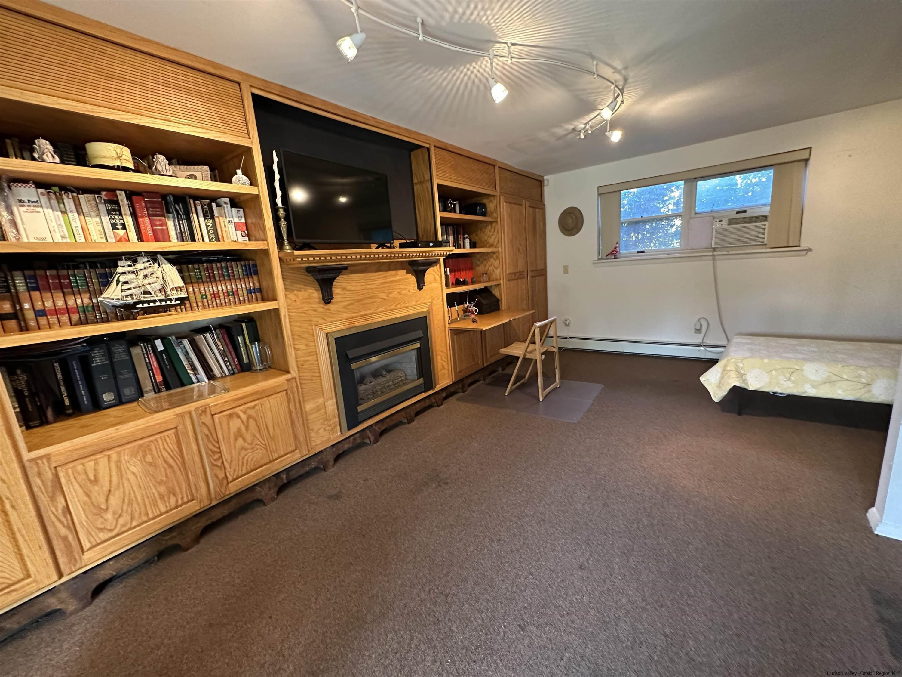 343 Cascade Drive Kingston, NY 12401 - Photo 23 of 33 a view of an empty room with furniture and window