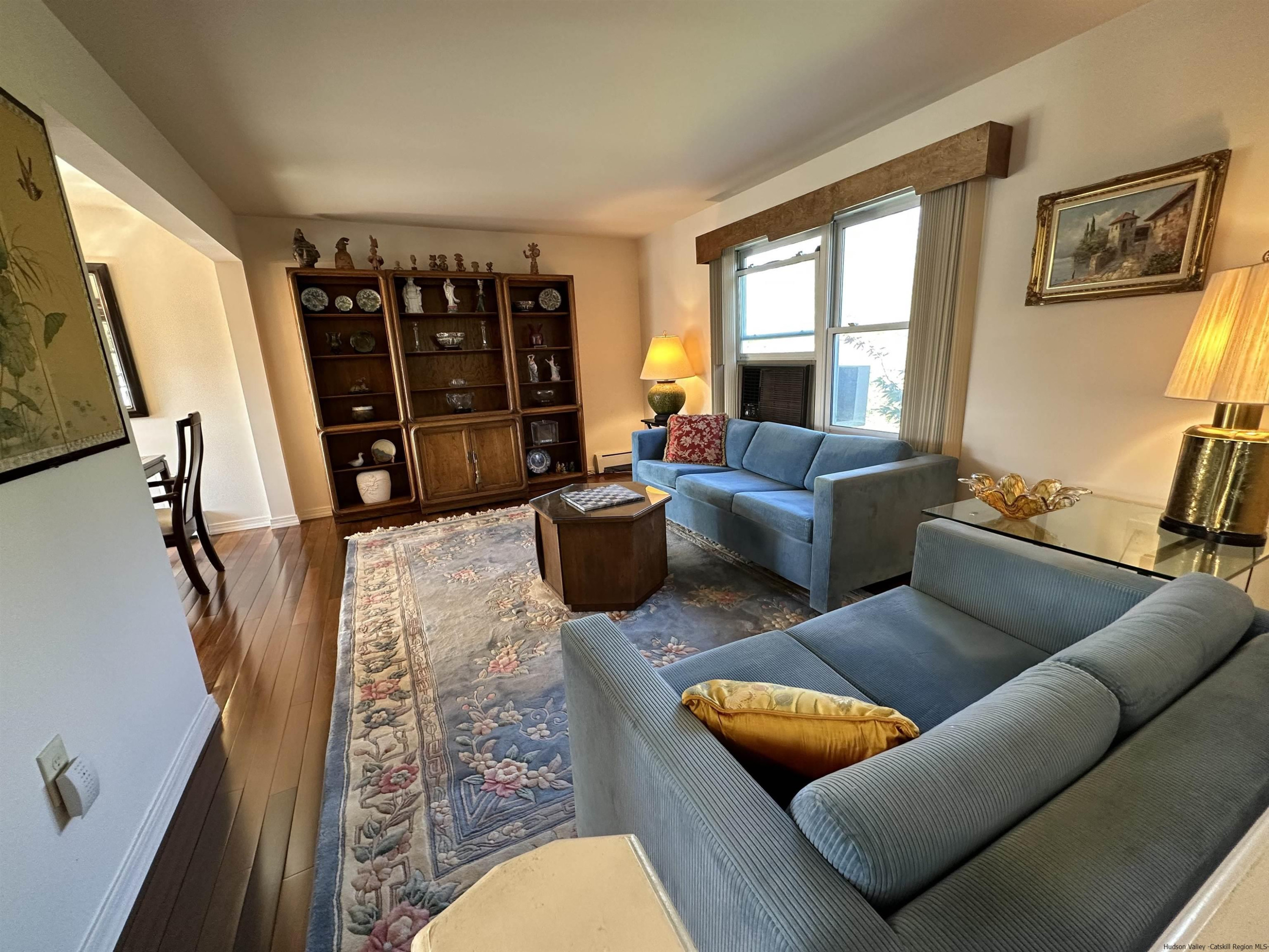 343 Cascade Drive Kingston, NY 12401 - Photo 3 of 33 a living room with furniture a couch and a flat screen tv