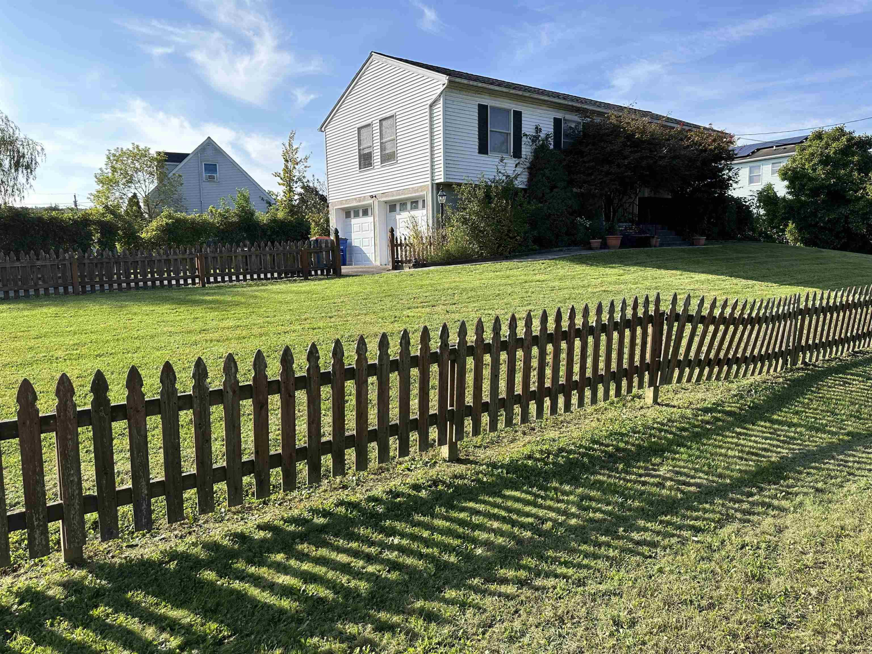 343 Cascade Drive Kingston, NY 12401 - Photo 32 of 33 a view of a house with backyard and a garden