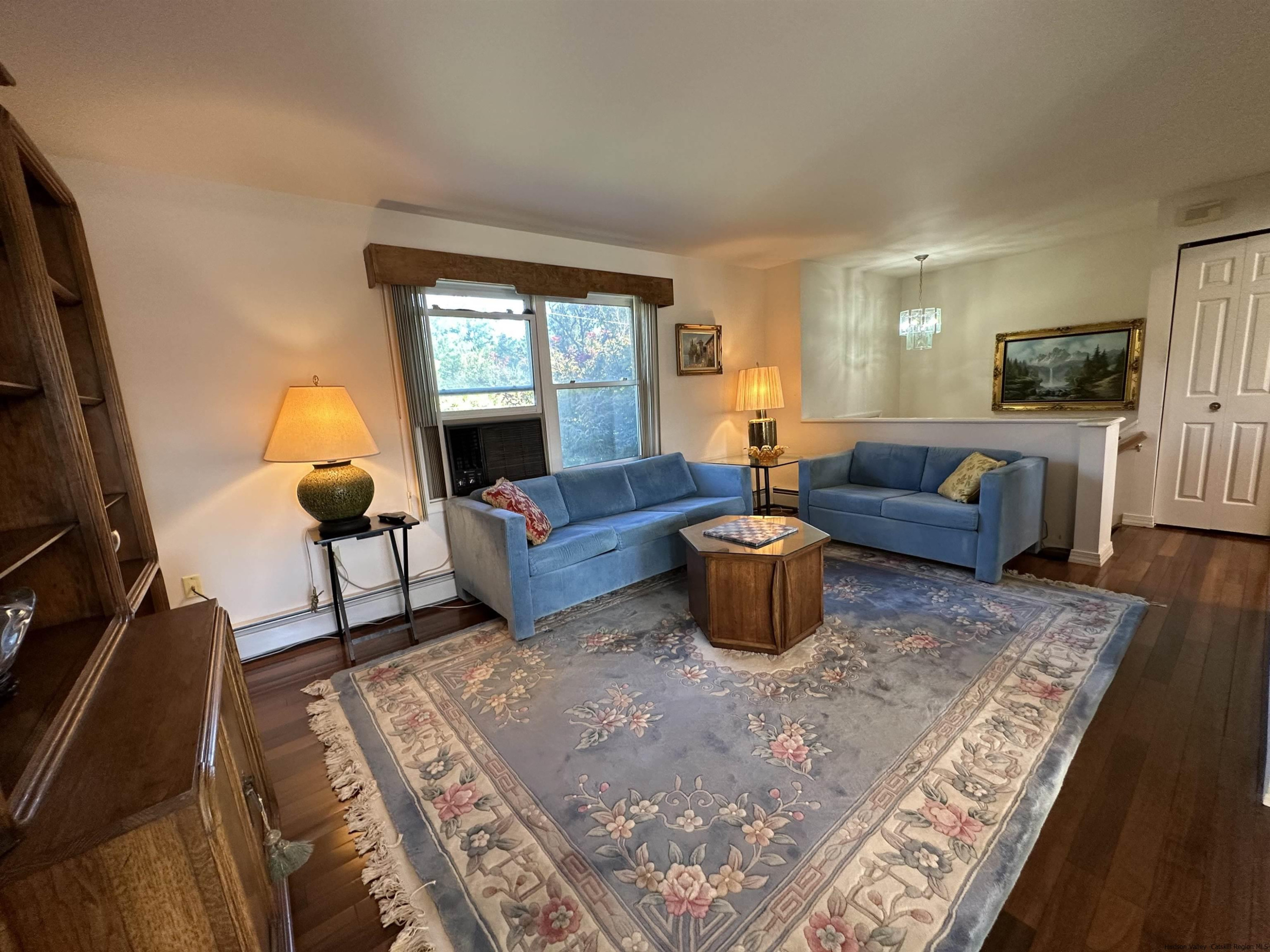 343 Cascade Drive Kingston, NY 12401 - Photo 4 of 33 a living room with furniture and a lamp