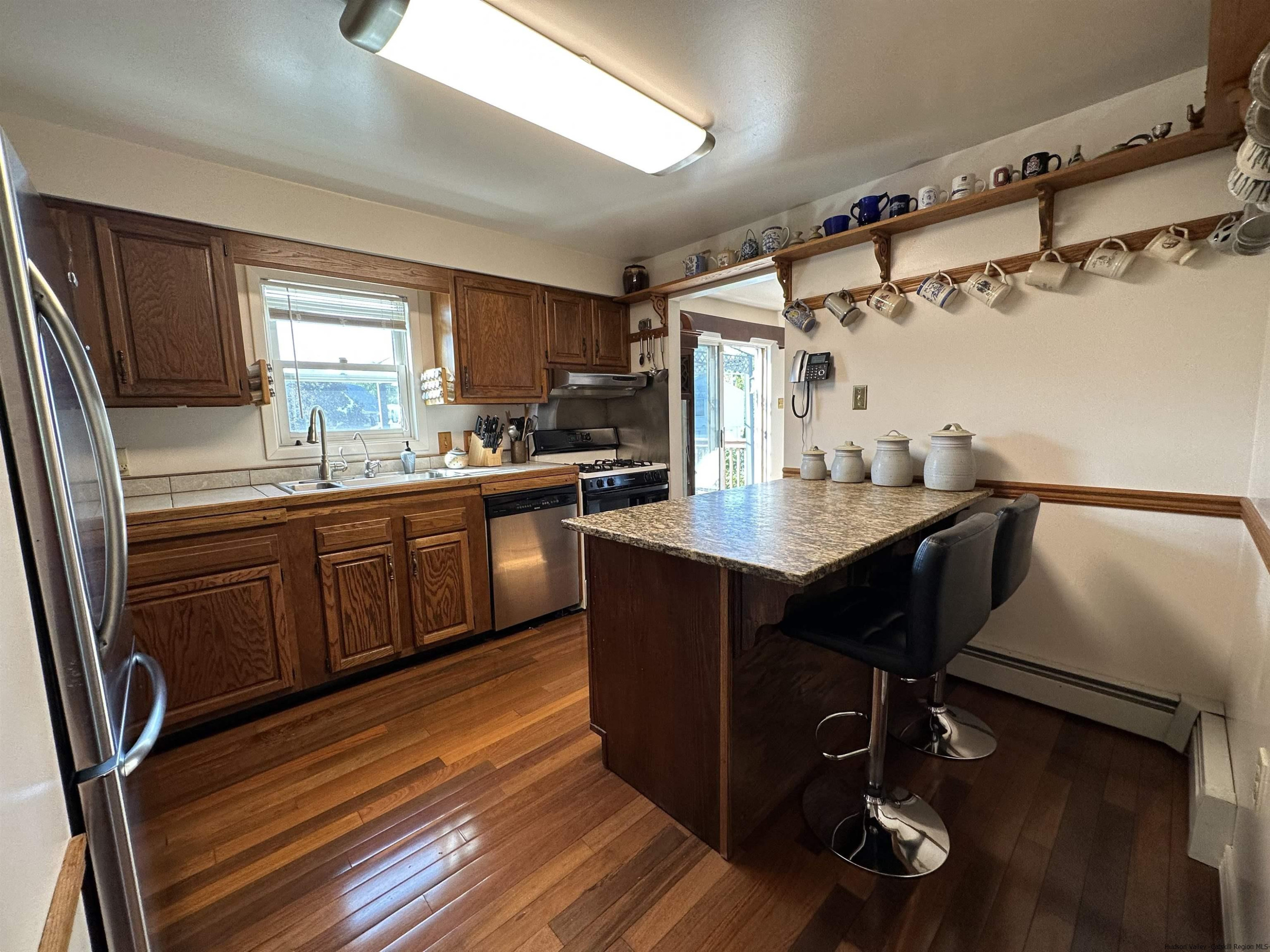 343 Cascade Drive Kingston, NY 12401 - Photo 9 of 33 a kitchen with a sink appliances and cabinets
