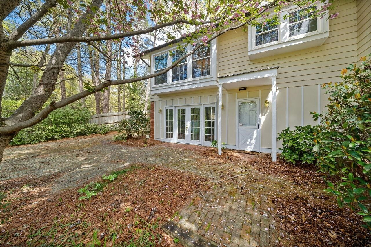 100 East Drewry Lane Raleigh, NC 27609 - Photo 5 of 18 Large Brick Patio with View of Natural Area