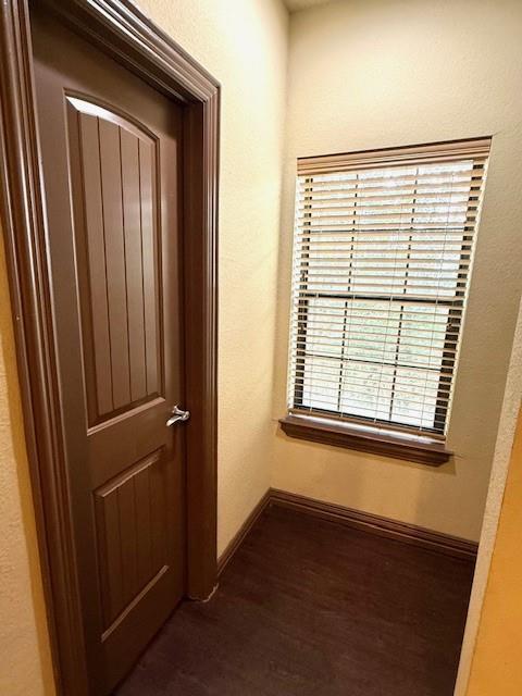 2410 South 2nd Street, Unit 1162 Waco, TX 76706 - Photo 9 of 33 an empty room with wooden floor and windows