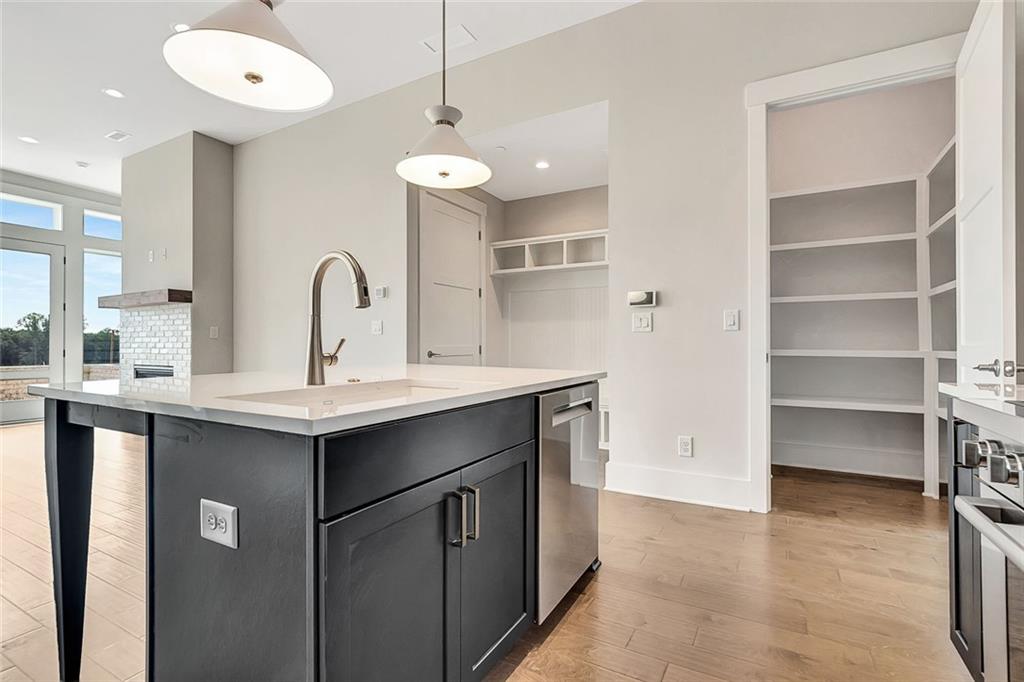 170 Rolison Way Fayetteville, GA 30214 - Photo 13 of 49 a kitchen with a sink stainless steel appliances and cabinets