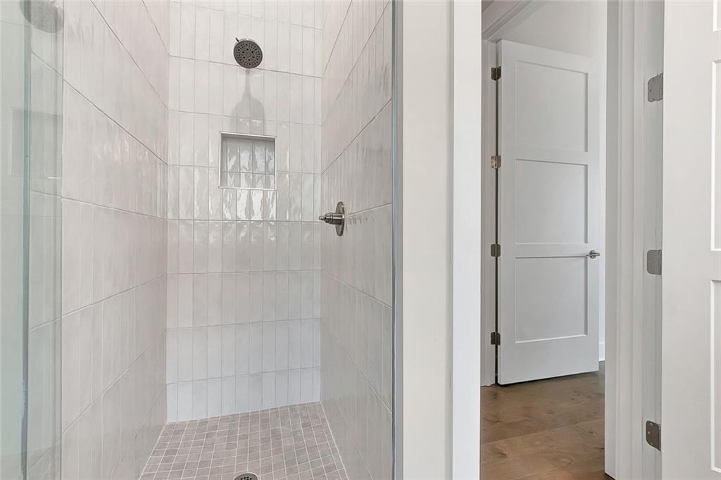 170 Rolison Way Fayetteville, GA 30214 - Photo 27 of 49 a bathroom with a glass shower door