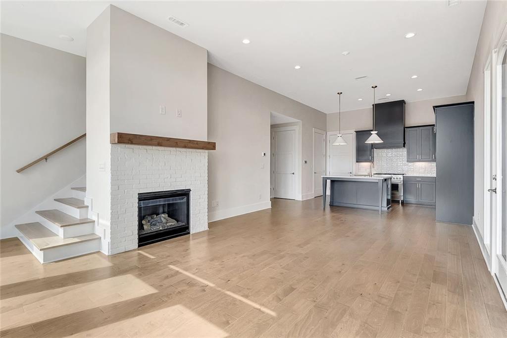170 Rolison Way Fayetteville, GA 30214 - Photo 3 of 49 a living room with furniture and a fireplace