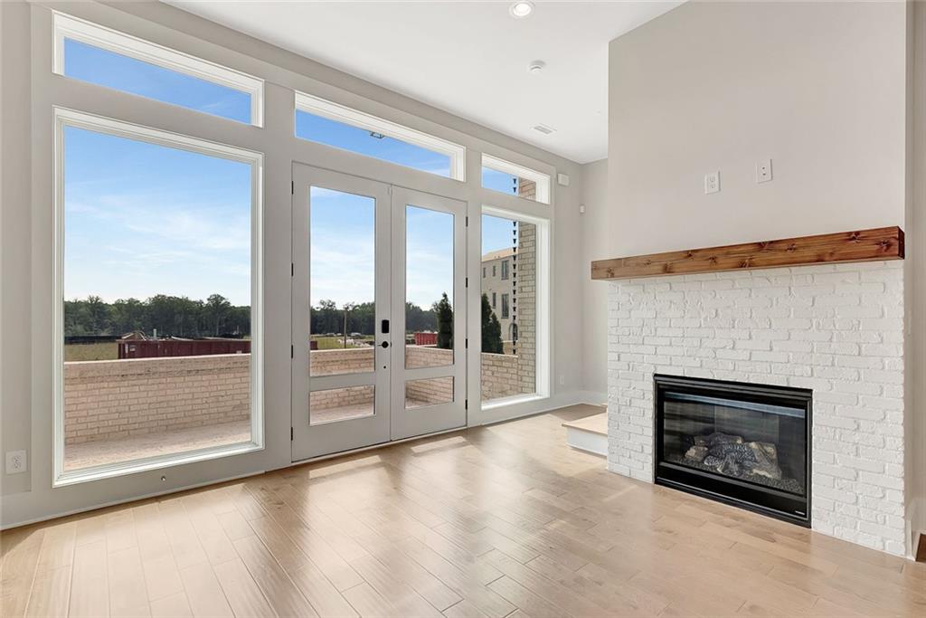 170 Rolison Way Fayetteville, GA 30214 - Photo 4 of 49 a view of an empty room with glass door and a fireplace