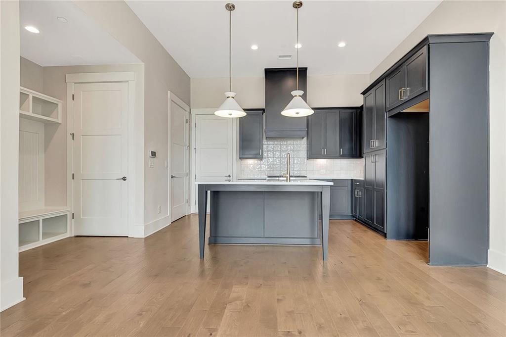 170 Rolison Way Fayetteville, GA 30214 - Photo 8 of 49 a kitchen with kitchen island a sink stainless steel appliances and cabinets
