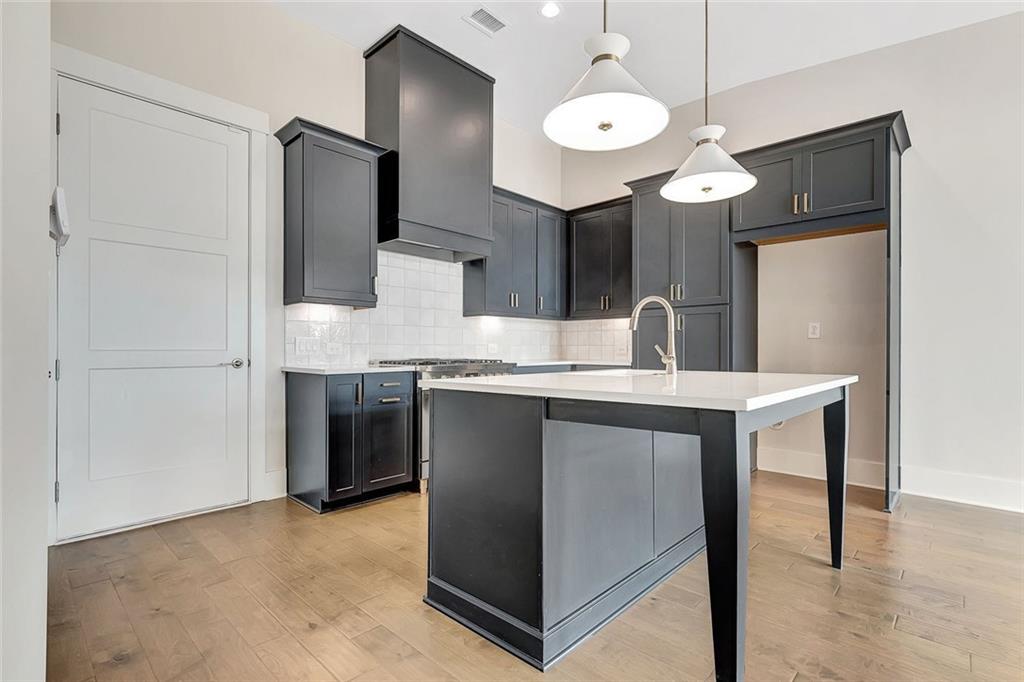 170 Rolison Way Fayetteville, GA 30214 - Photo 10 of 49 a kitchen with kitchen island a counter top space appliances and cabinets