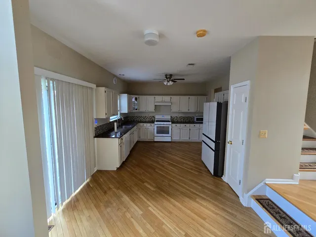 a large kitchen with a lot of counter space
