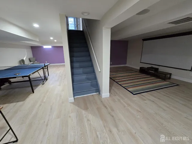 a view of a livingroom with furniture and wooden floor