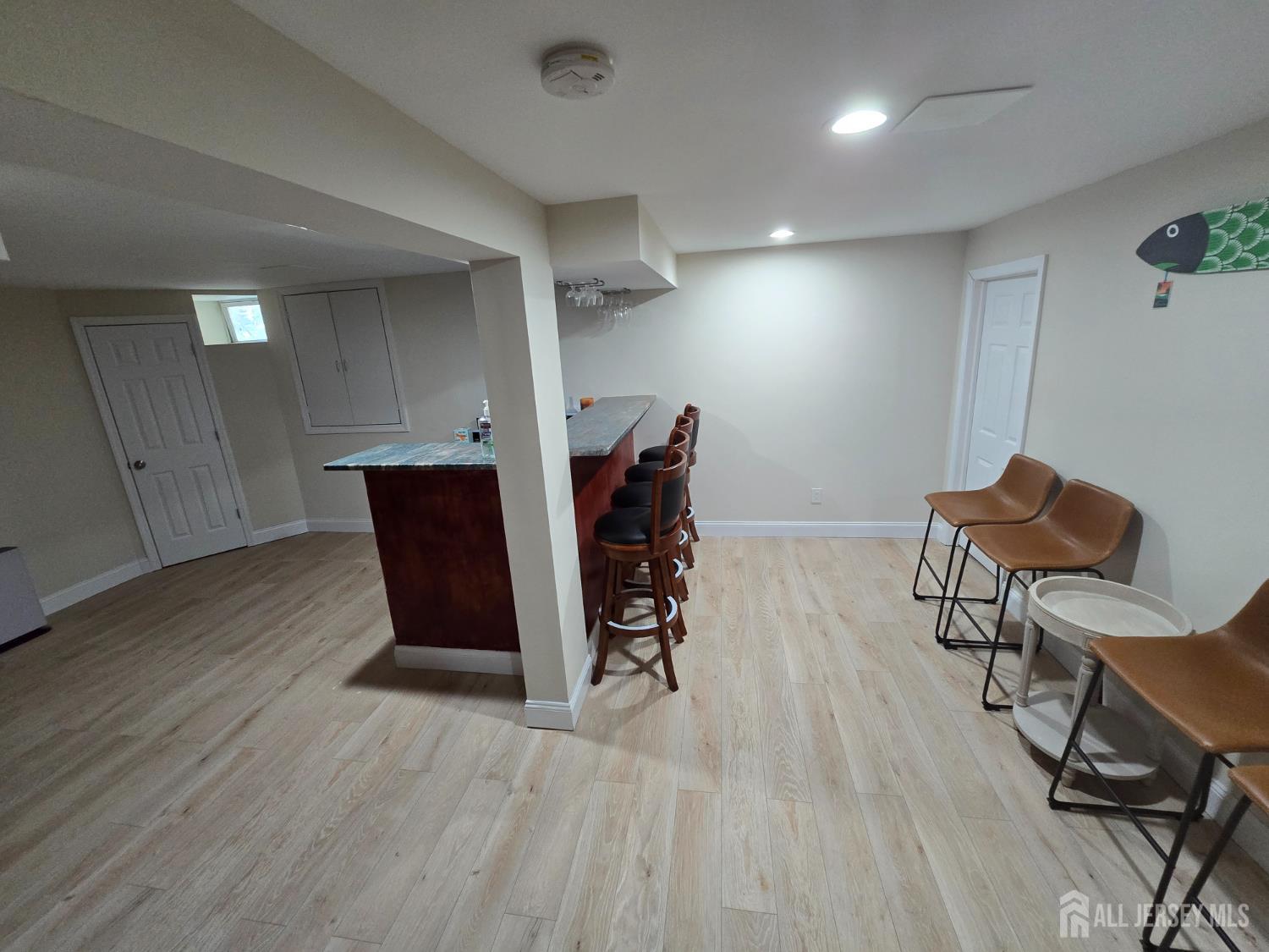 40 Potomac Road Monmouth Junction, NJ 08852 - Photo 20 of 48 a view of a workspace with furniture and wooden floor
