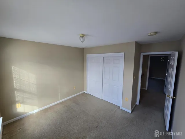 a view of an empty room and closet