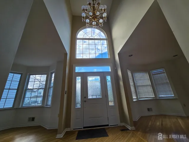 a view of an entryway with wooden floor