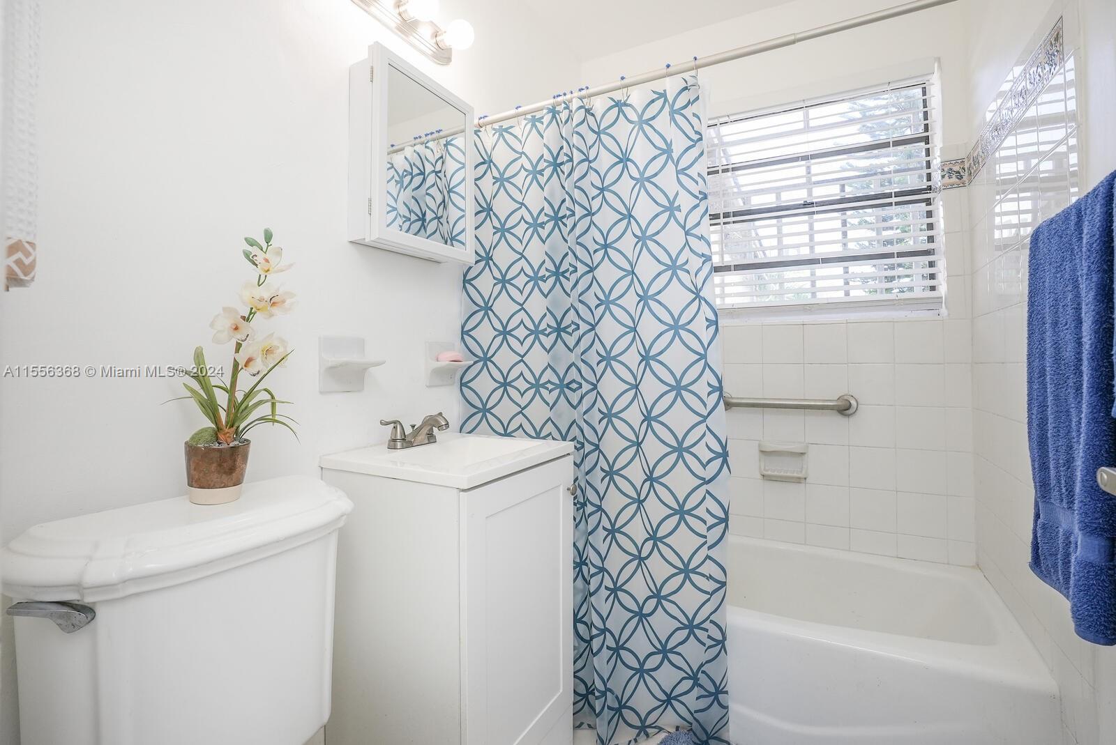 8461 Southwest 38th Street Miami, FL 33155 - Photo 14 of 27 a bathroom with a sink a mirror and a shower