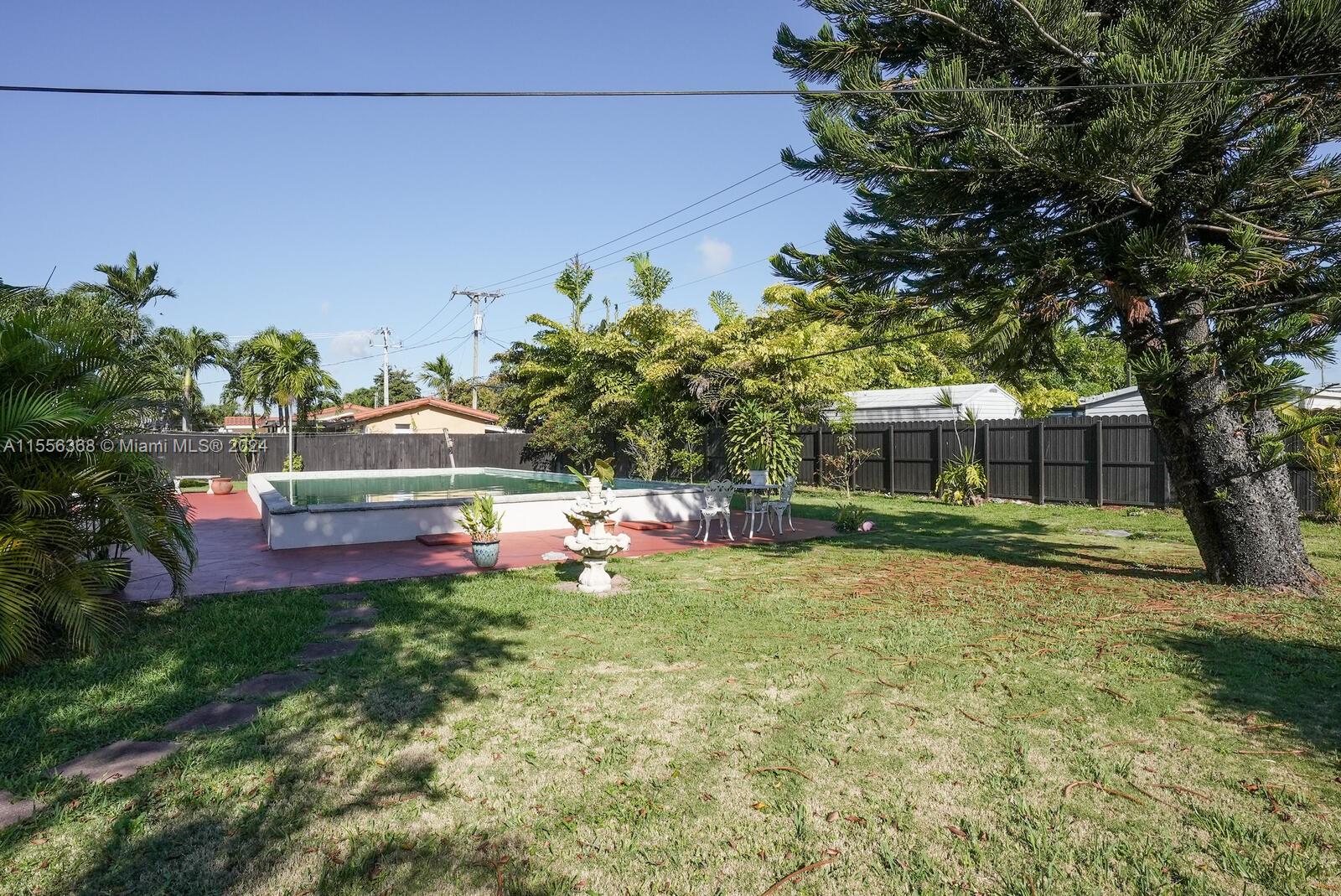 8461 Southwest 38th Street Miami, FL 33155 - Photo 16 of 27 a view of a house with a yard