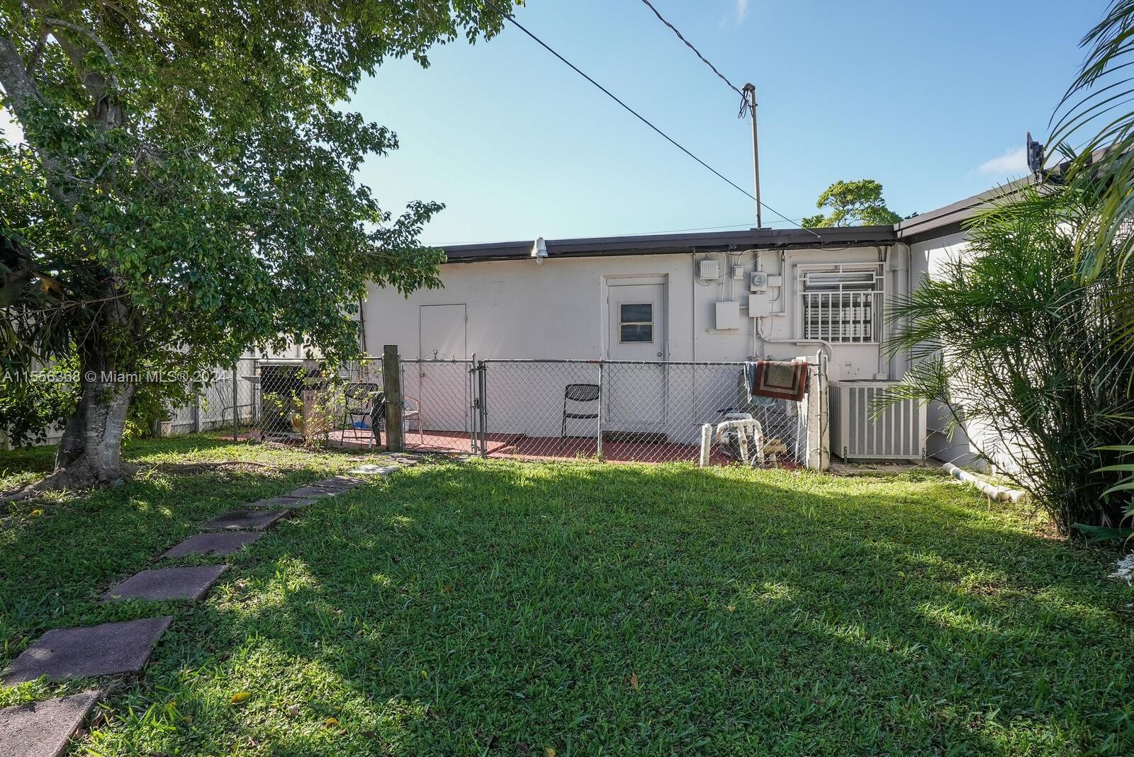 8461 Southwest 38th Street Miami, FL 33155 - Photo 17 of 27 a view of a back yard of the house
