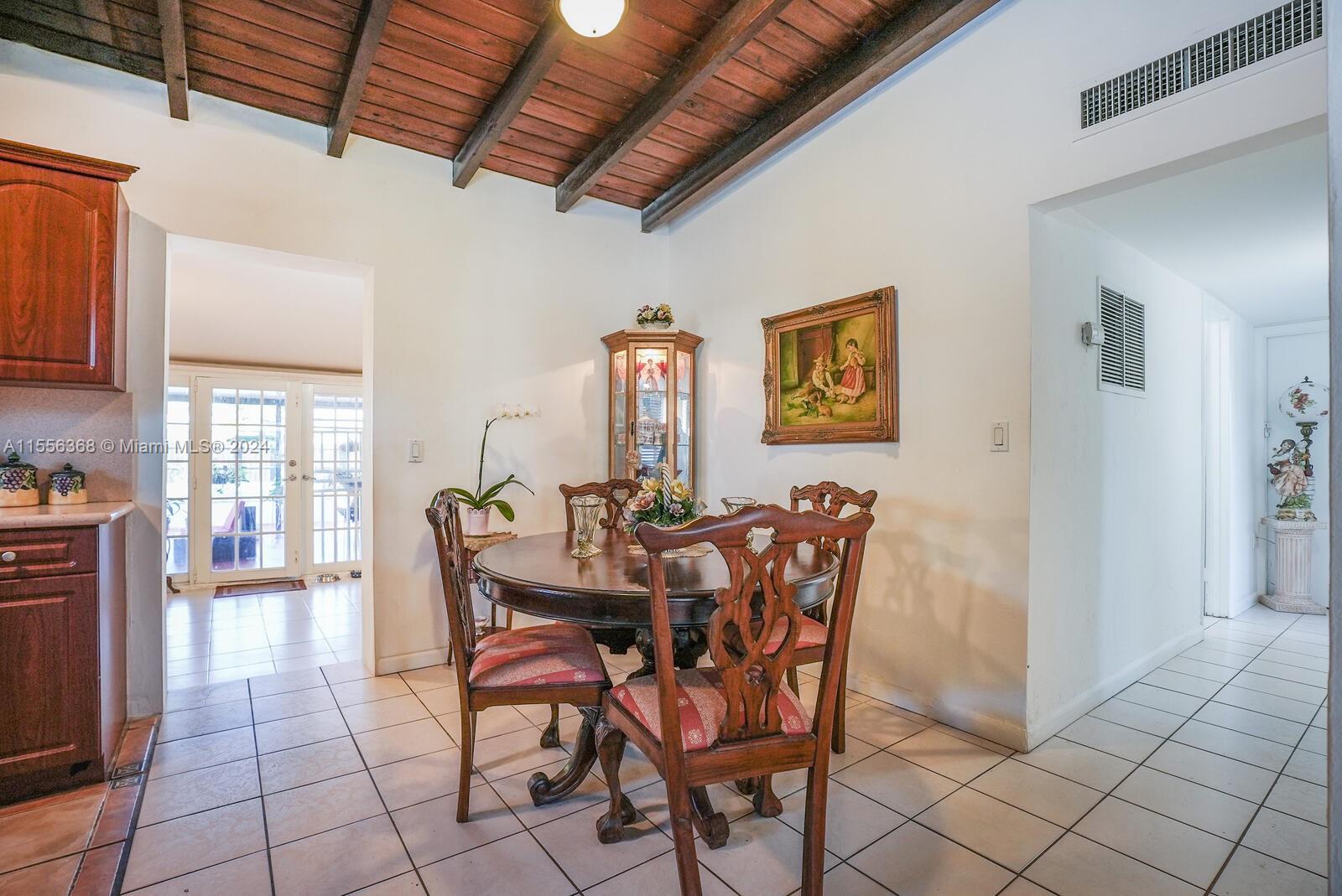 8461 Southwest 38th Street Miami, FL 33155 - Photo 5 of 27 a view of a dining room with furniture