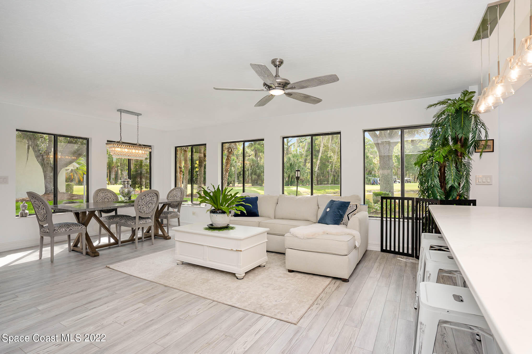 1425 Kitty Hawk Way Melbourne, FL 32940 - Photo 17 of 53 a living room with furniture and a large window