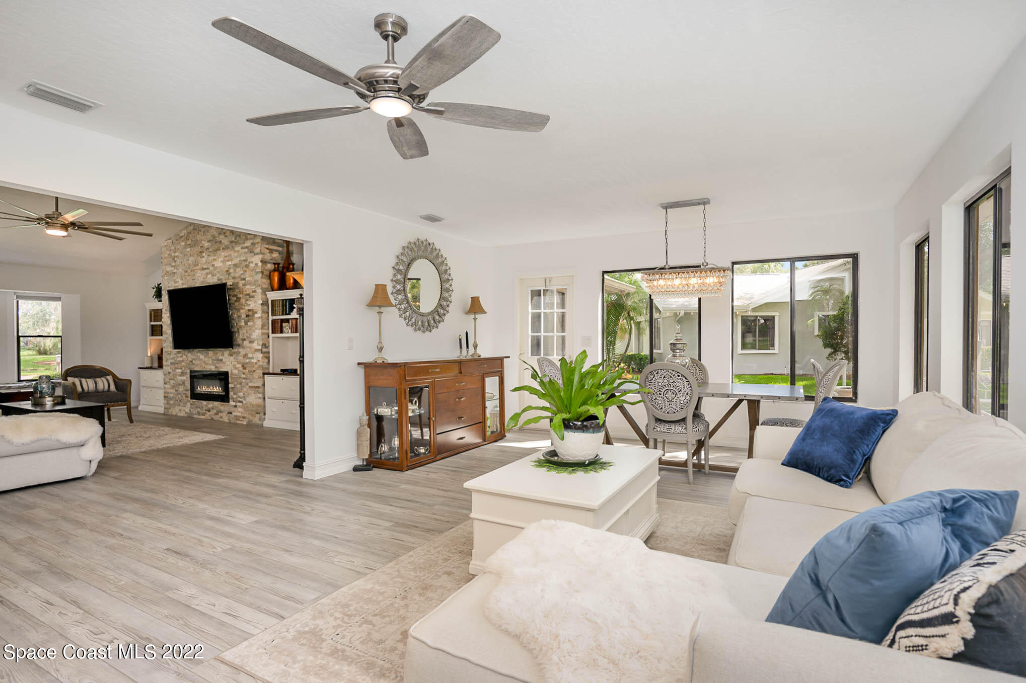 1425 Kitty Hawk Way Melbourne, FL 32940 - Photo 18 of 53 a living room with furniture and a flat screen tv
