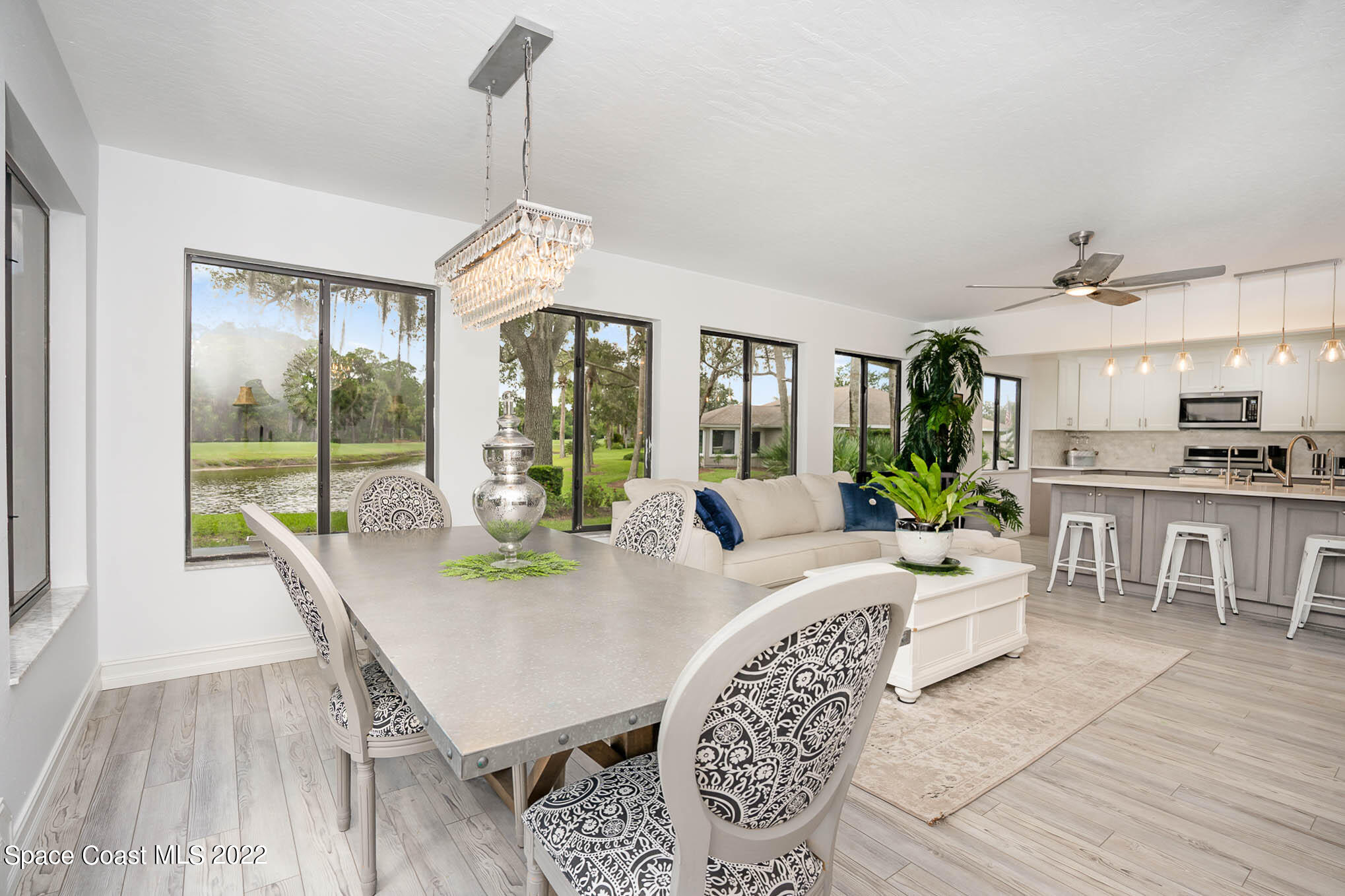 1425 Kitty Hawk Way Melbourne, FL 32940 - Photo 20 of 53 a view of a dining room with furniture window and wooden floor