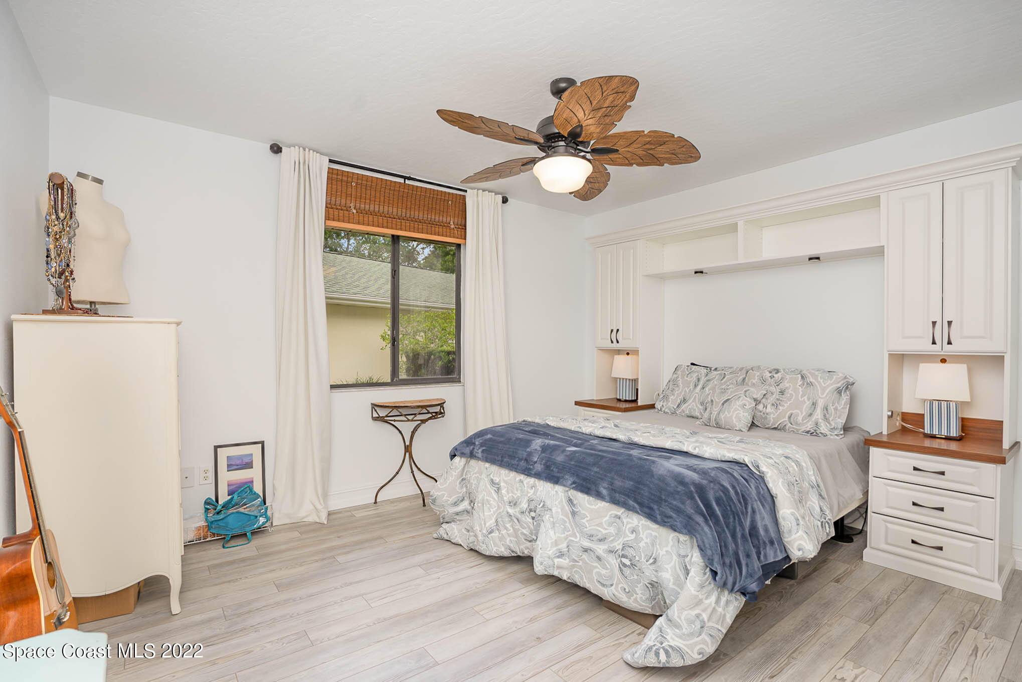 1425 Kitty Hawk Way Melbourne, FL 32940 - Photo 28 of 53 a bedroom with a bed dresser and a window