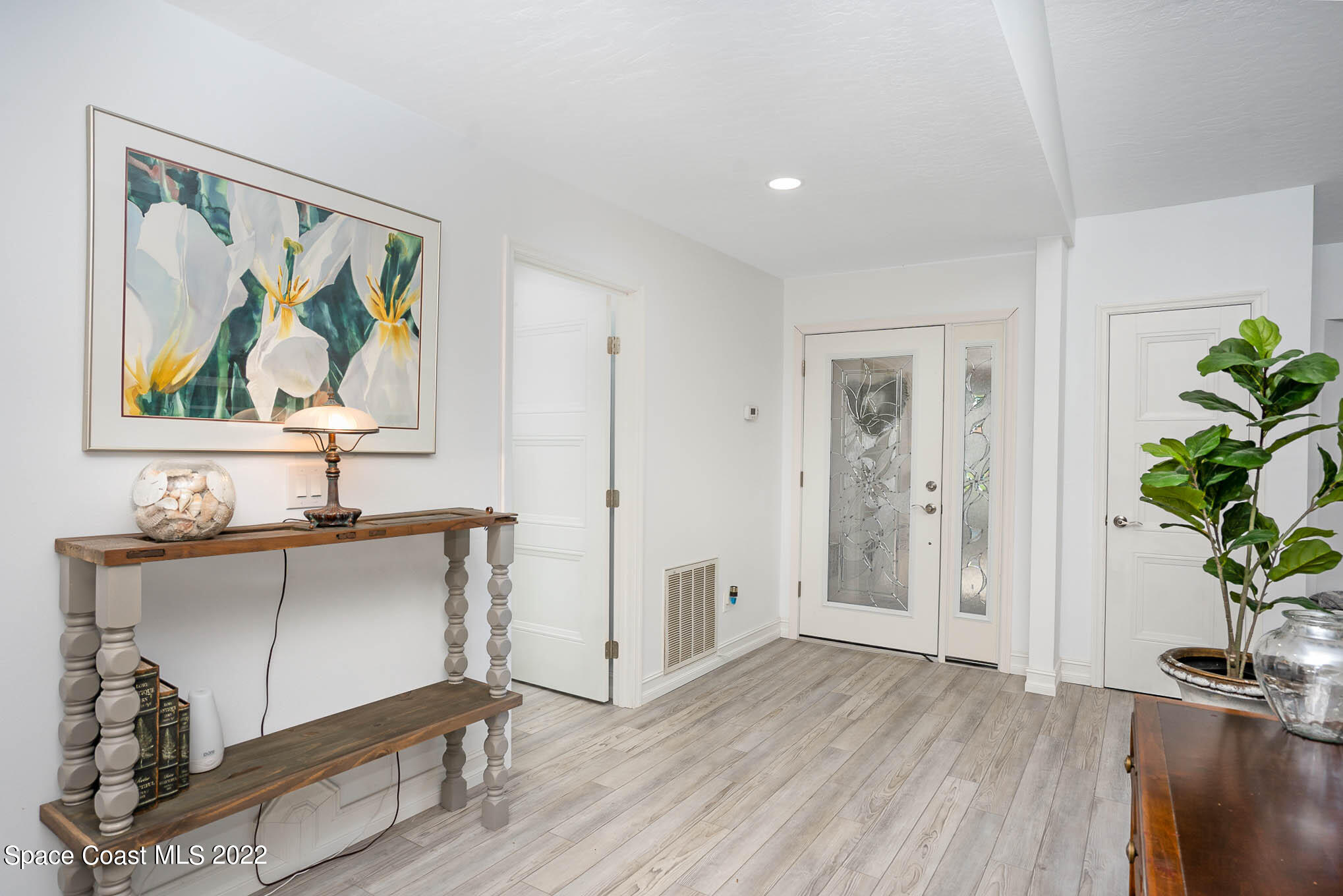 1425 Kitty Hawk Way Melbourne, FL 32940 - Photo 3 of 53 a view of a room that has a painting on the wall