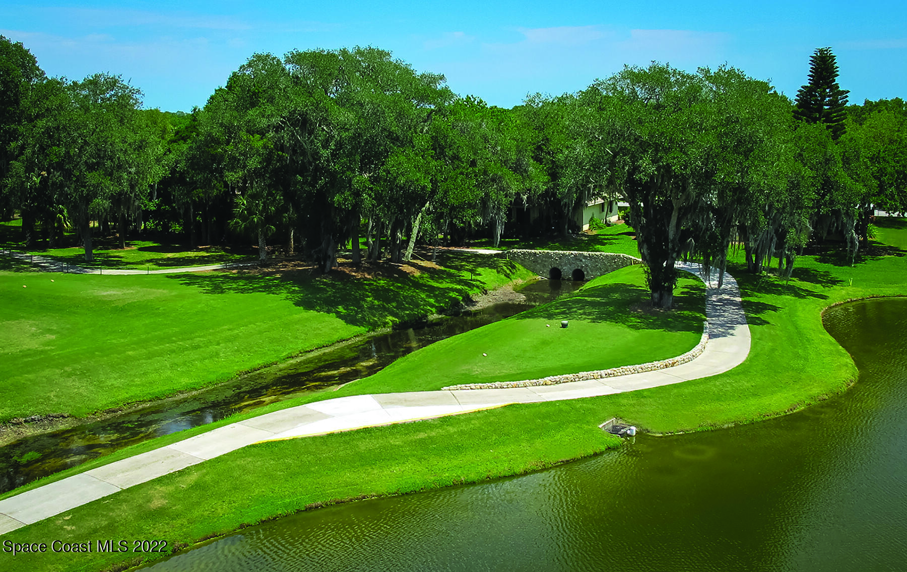 1425 Kitty Hawk Way Melbourne, FL 32940 - Photo 38 of 53 a view of a golf course with a garden