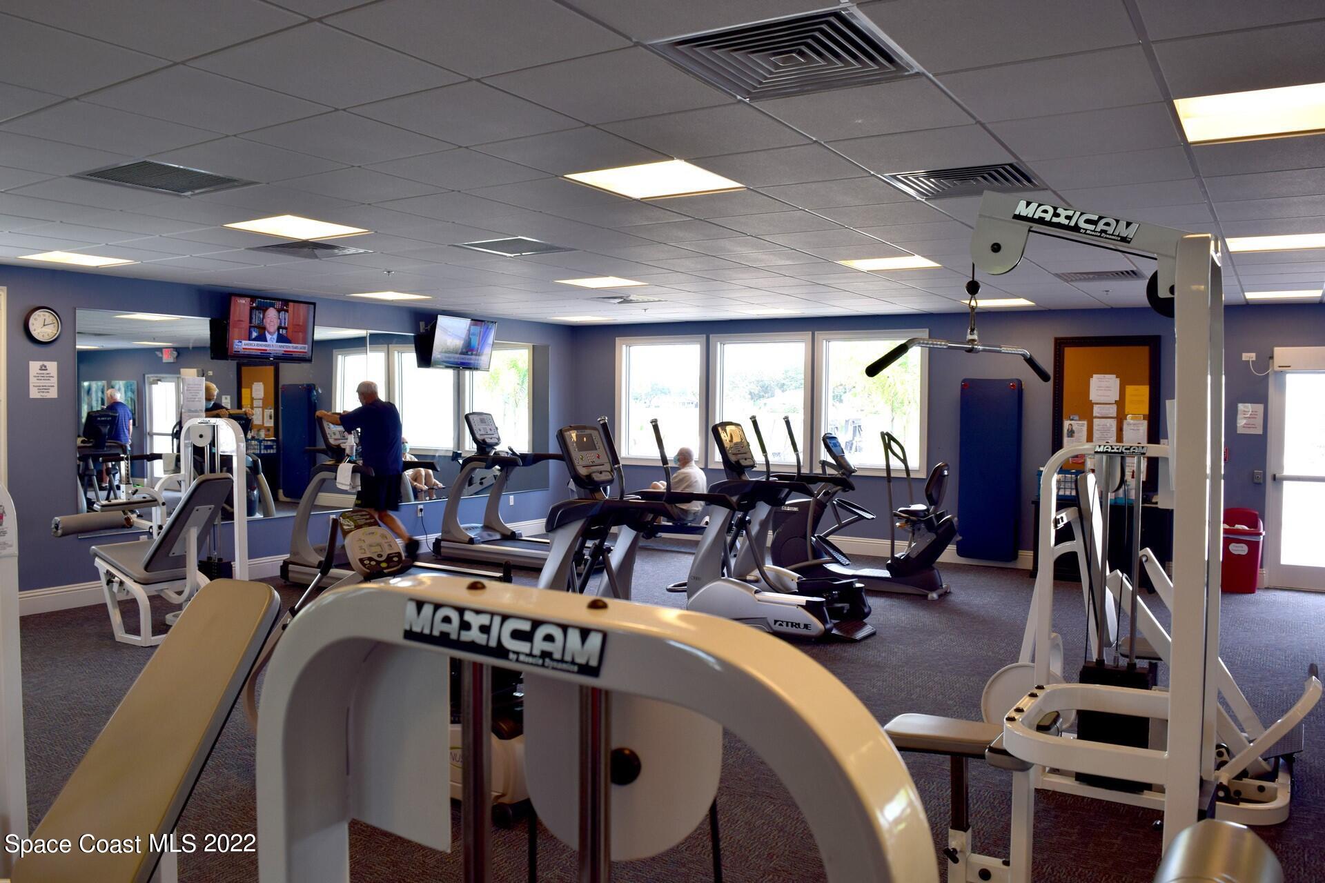 1425 Kitty Hawk Way Melbourne, FL 32940 - Photo 50 of 53 a view of a room with gym equipment