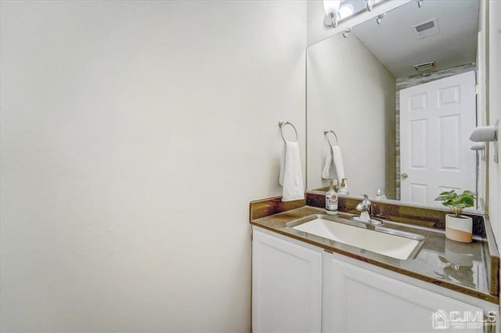 9 Tory Court Bedminster, NJ 07921 - Photo 12 of 26 a bathroom with a sink and a mirror