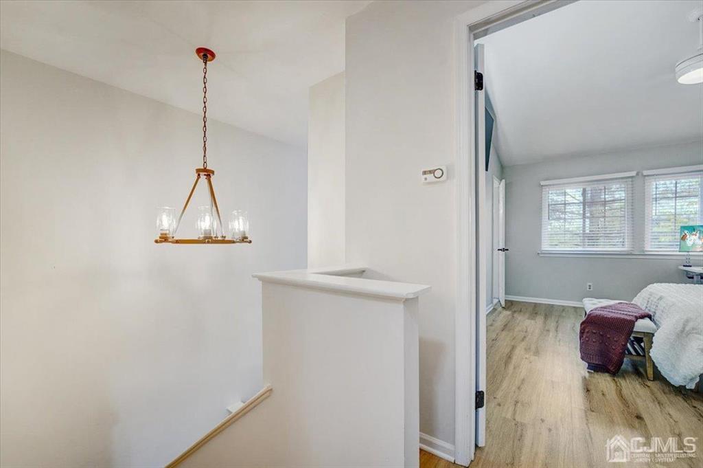 9 Tory Court Bedminster, NJ 07921 - Photo 15 of 26 a view of bedroom with a bed and wooden floor