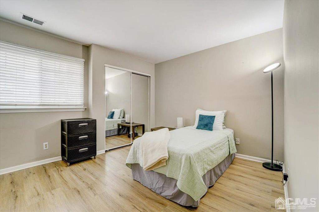 9 Tory Court Bedminster, NJ 07921 - Photo 22 of 26 a bedroom with a bed and wooden floor