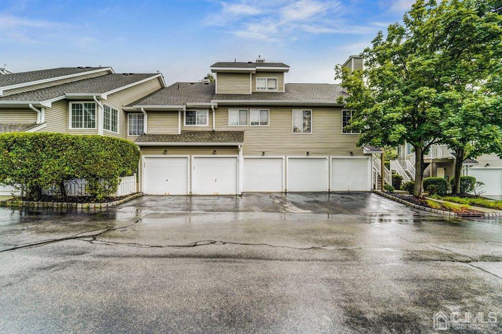 9 Tory Court Bedminster, NJ 07921 - Photo 26 of 26 a view of a white house with large windows and a road